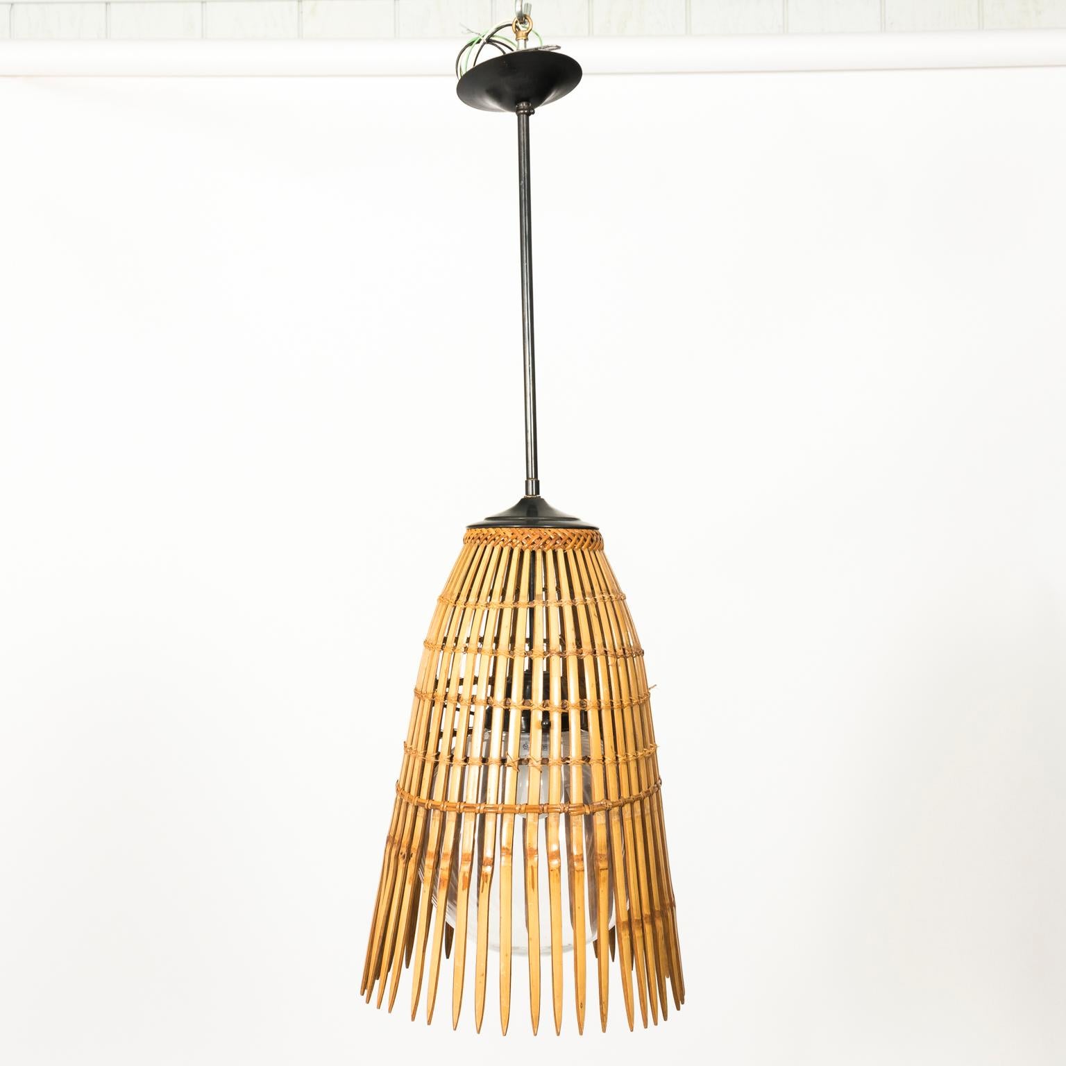 Mid-20th century bamboo ceiling light with glass dome insert and rattan braided trim.
 