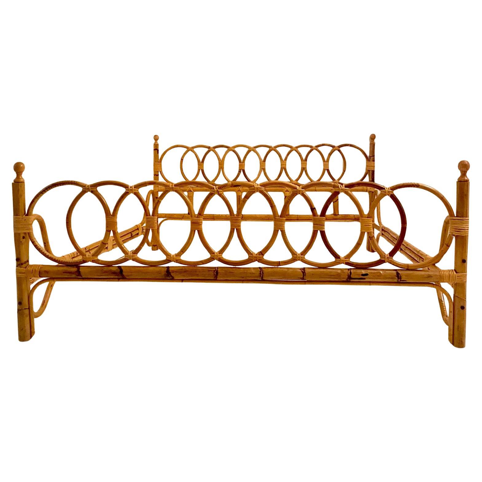 Mid-Century Modern Bamboo Queen Size Bed Frame – Italy, 1960s

This exquisite artisanal queen-size bed frame, crafted in Italy during the 1960s, embodies the elegance and charm of mid-century modern design. Made entirely of bamboo, the structure is