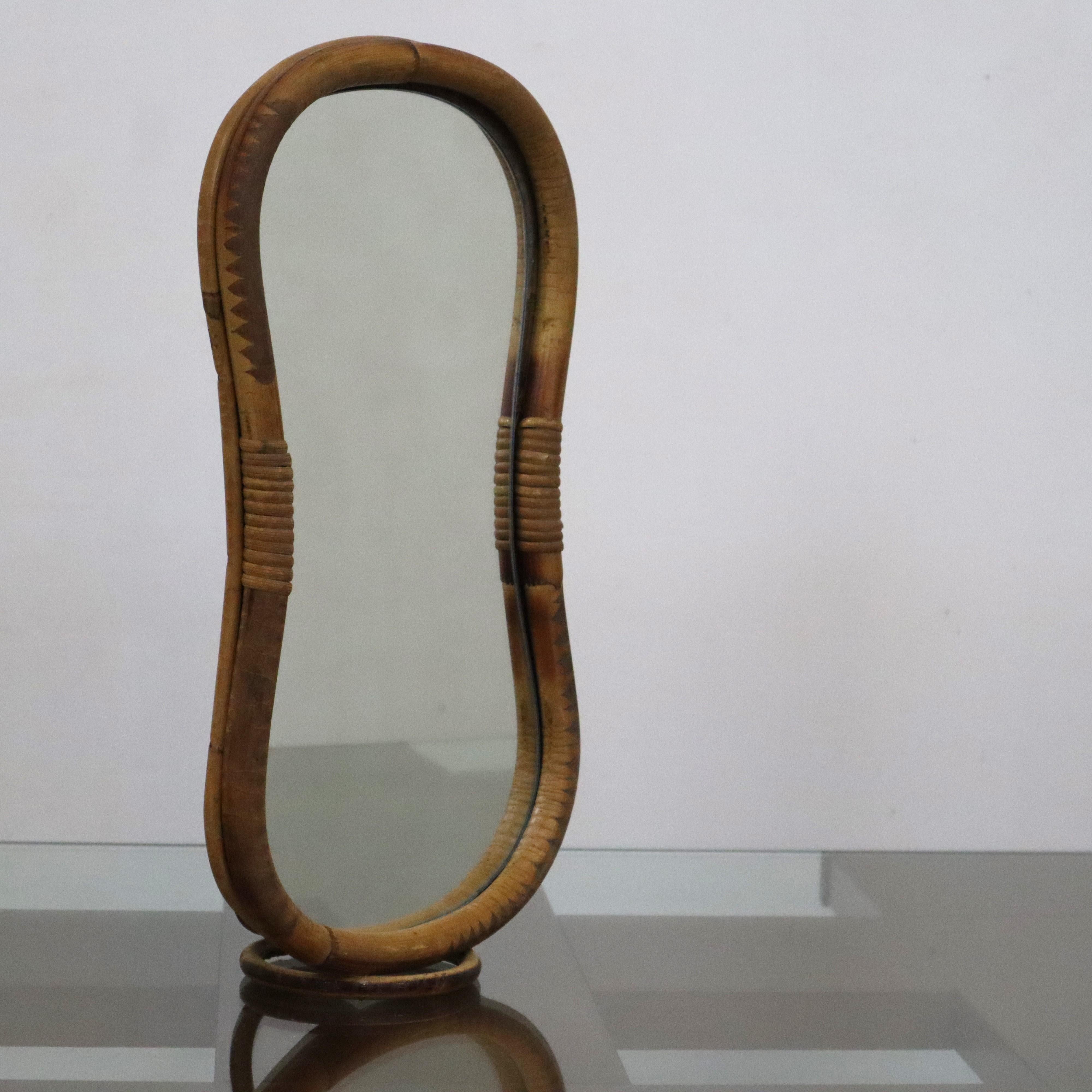 Mid-century modern bamboo dressing table mirror, Italy, 1970s
This mid-century modern bamboo dressing table mirror, crafted in Italy during the 1970s, is a timeless example of vintage design. Featuring a simple and minimalist aesthetic, this piece