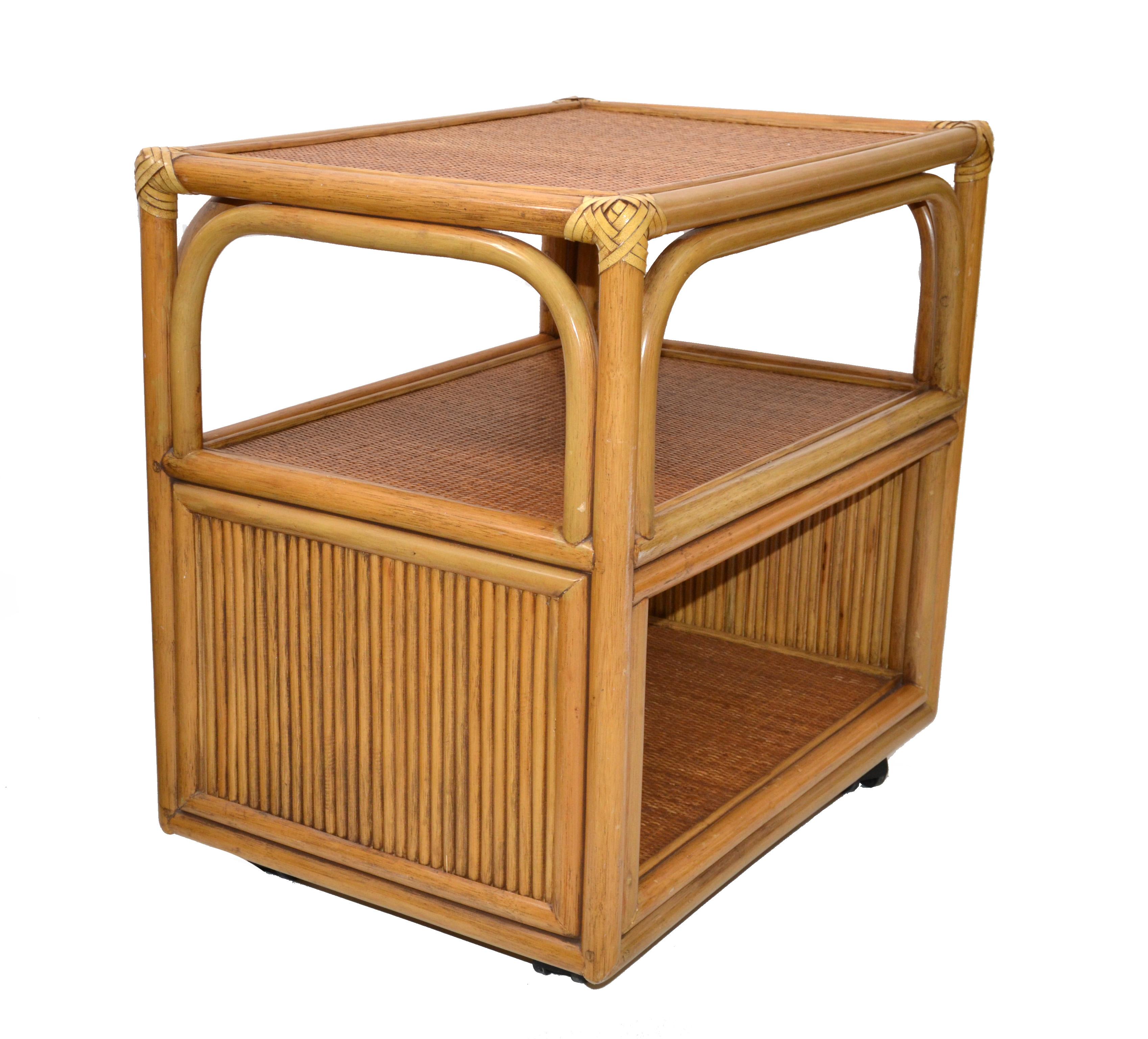 Vintage bamboo, cane and handwoven Serving Cart, side table, end table, bedside table, kitchen cart with leather bindings to the corners.
The 4 casters run smoothly.
Bohemian Chic for Tropical Home Settings. 
 
