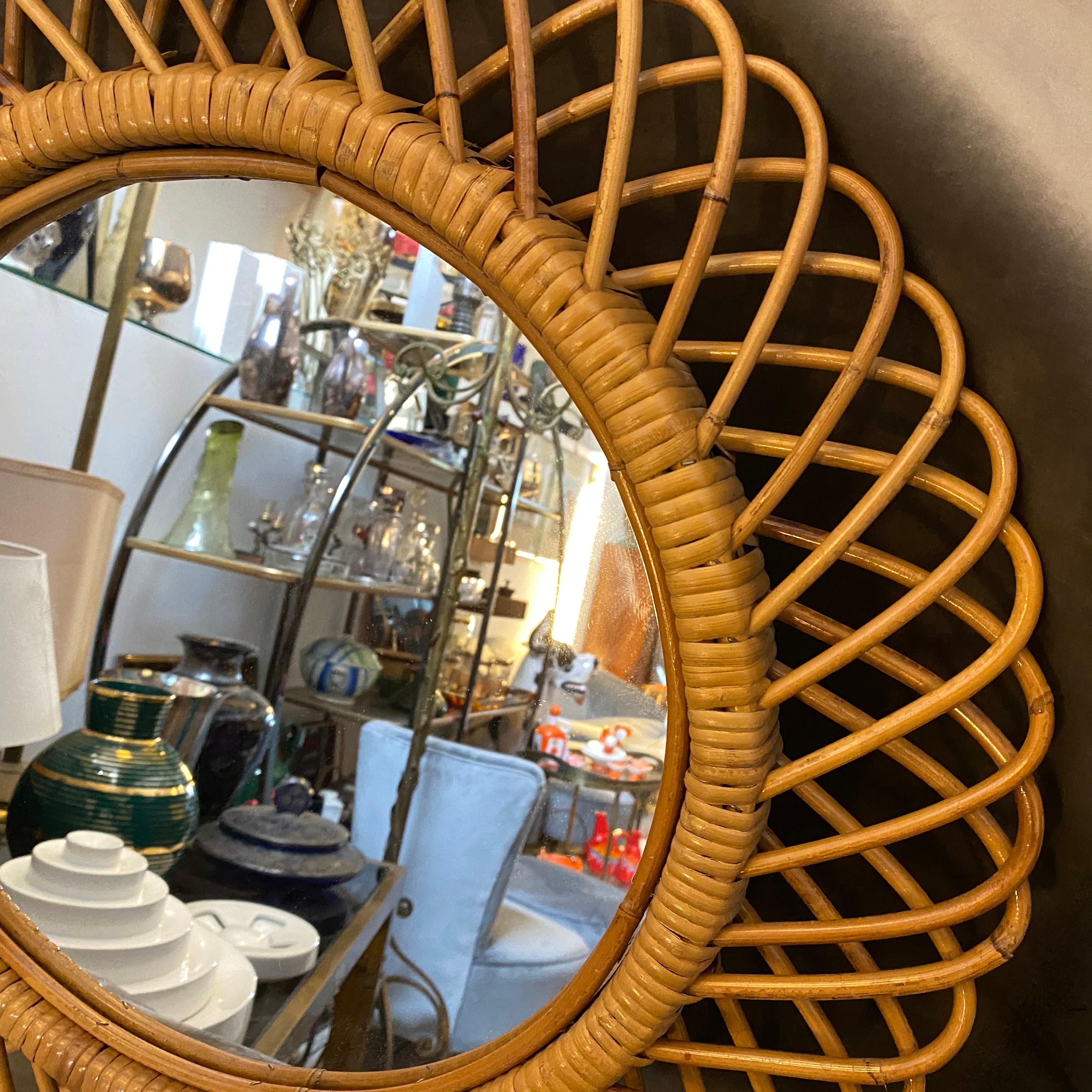 A bamboo round wall mirror made in Italy in the 1960s. Bamboo, mirror and red velvet back part are in good conditions.
