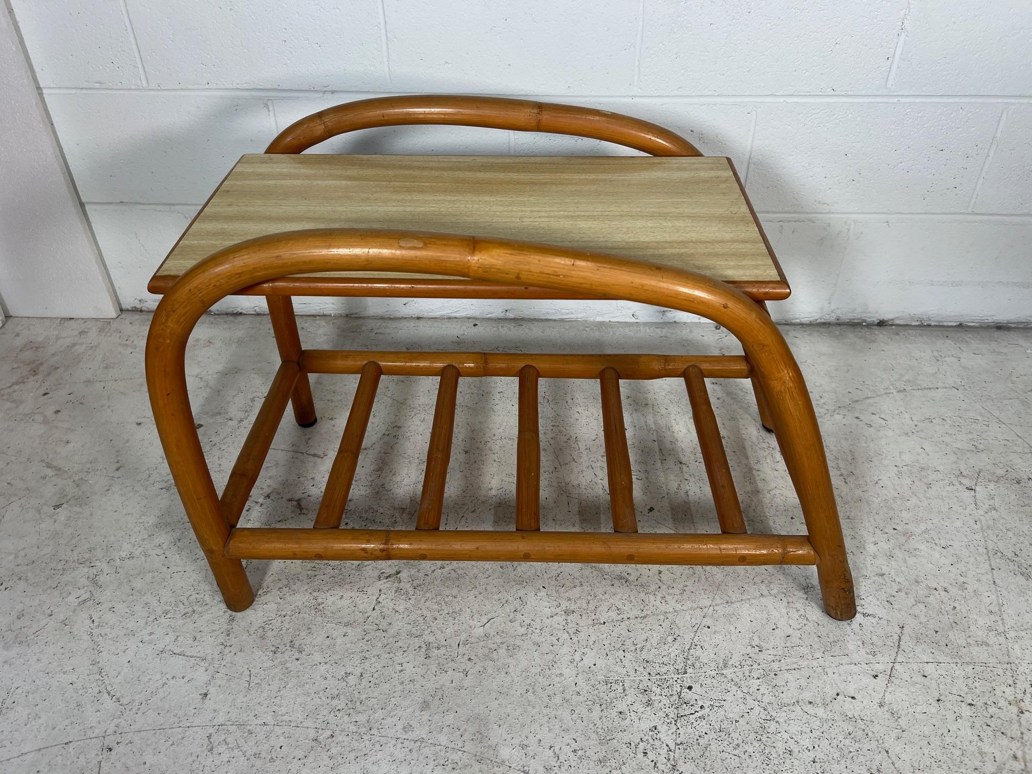 Bamboo and rattan side table set. Part of a larger bamboo sun room set. Unrestored. Very good condition. Minor wear. Attributed to Beverly Hills.
Dimensions:
Side table: 16