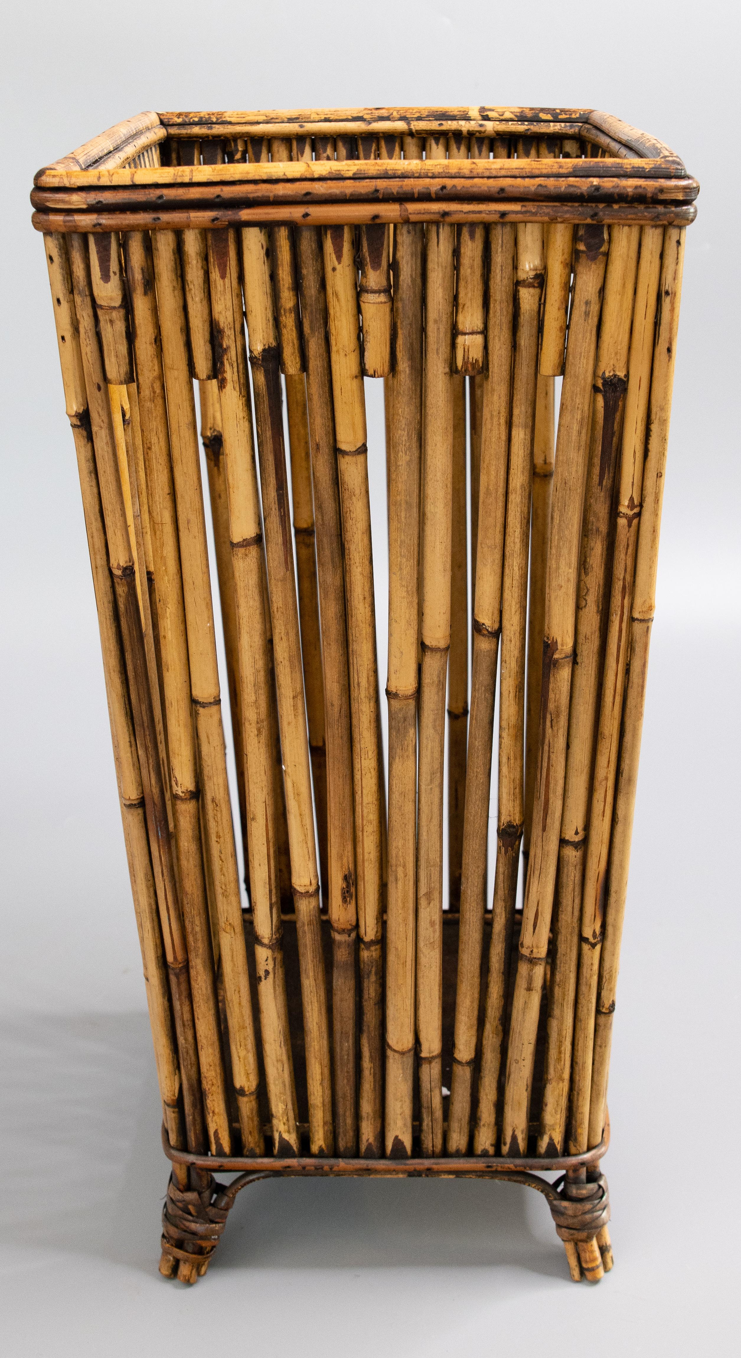 A fabulous Mid-Century bamboo and rattan footed umbrella or walking stick stand. This chic umbrella stand is well made and sturdy with a stylish Mid-Century Modern design. It would be perfect in an entryway for umbrellas or walking
