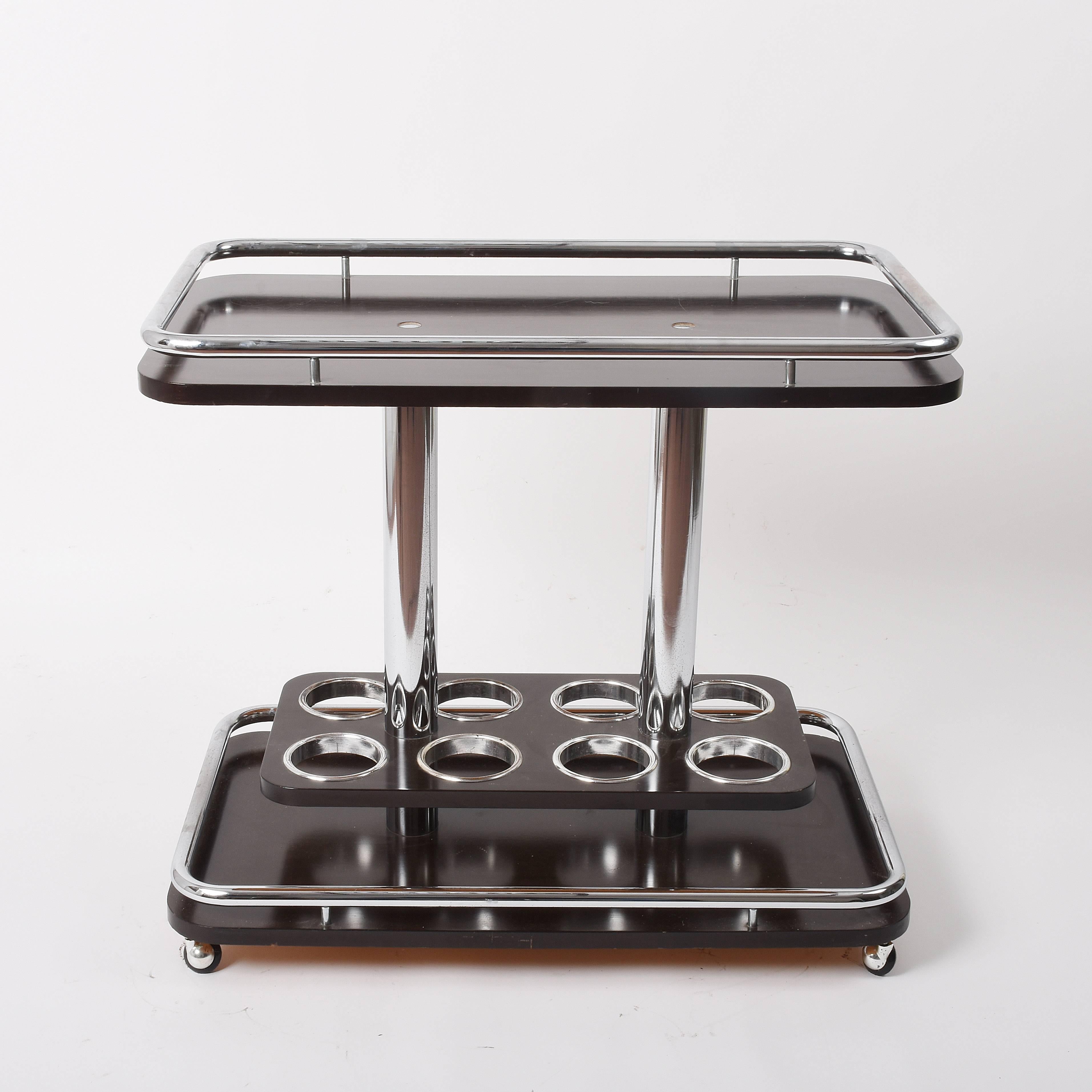 Italy elegant, 1970s bar cart Afra e Tobia Scarpa manner chromed metal and lacquered wood in excellent conditions. Wine bar trolley with bottle holder Measures cm: H 70, W 80, D 49 (internal shelves H 56 cm).
