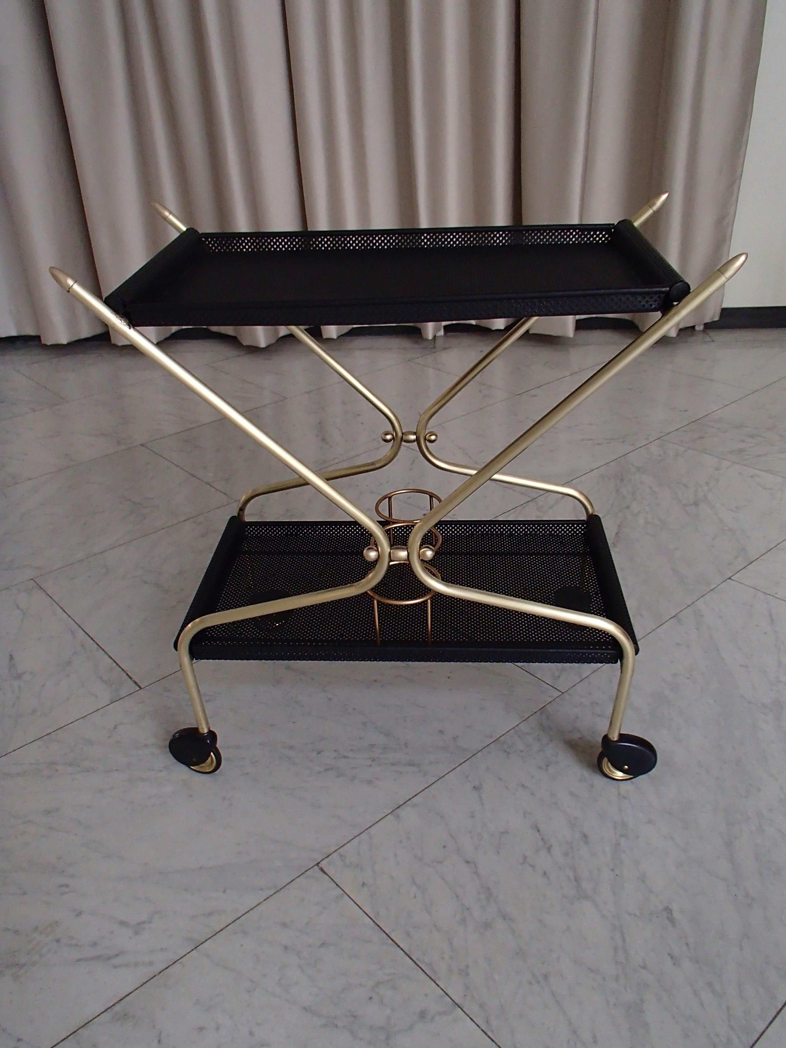 Mid-Century Modern bar cart in the style of Mathieu Matégot.