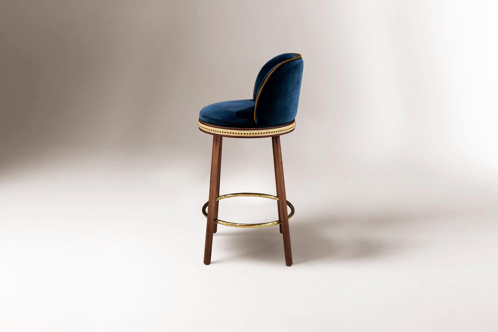 DOOQ Mid-Century Modern Bar Chair Alma with Blue Velvet, Walnut Wood and Brass

In a piece that combines classic and modern aesthetics we can find a certain harmonic gracefulness paired with an intimate voluptuousness that can embrace you and