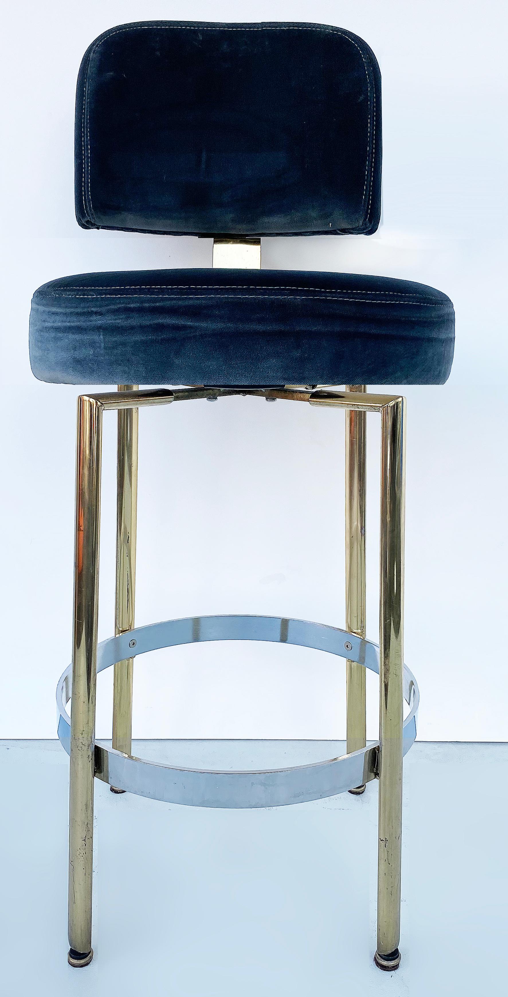 Mid-Century Modern bar stools with Pollack NYC velvet upholstery, pair

Offered is a pair of stainless steel and brass Mid-Century Modern bar stools that have recently been reupholstered in Pollack NYC navy blue velvet fabric. The stools are quite