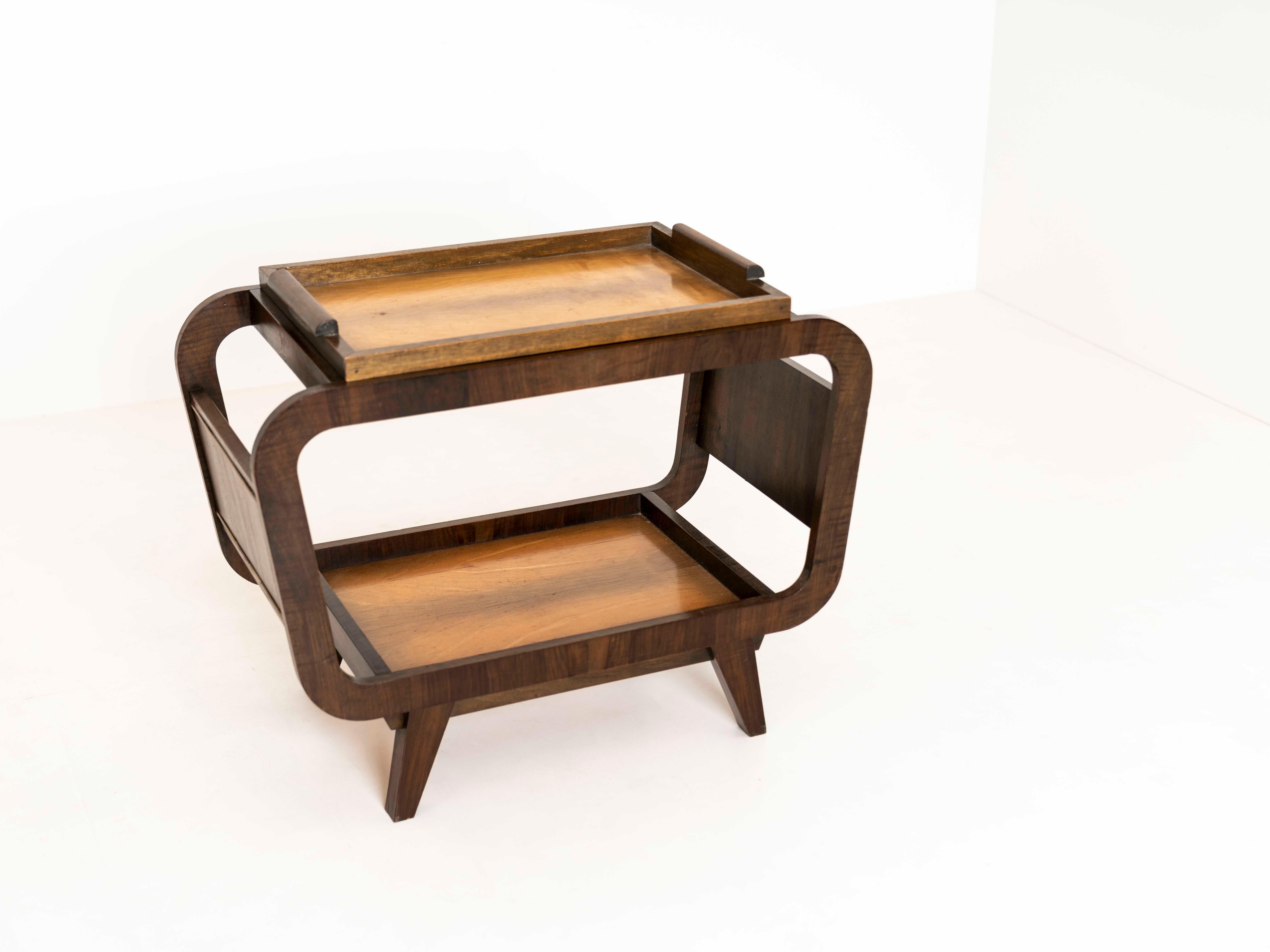 Charming Mid-Century Modern bar table. This table has a great design in dark-colored wood with brass details. The top is removable and makes a serving tray. This is an amazing piece to display your luxury alcohol bottles and serve them during a
