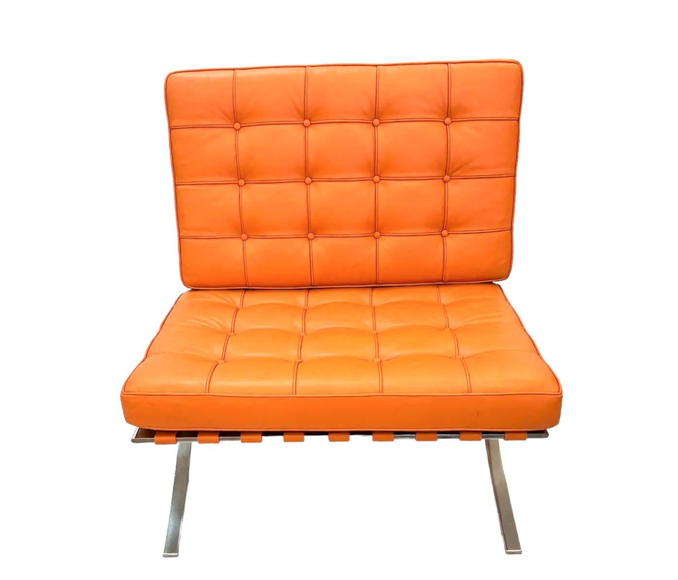 Introducing a Trendy Barcelona-Style Chair in a vibrant tangerine hue, inspired by the iconic designs of Mies van der Rohe. This contemporary chair captures the essence of modernism.

The chair's tufted cushions are meticulously crafted, constructed