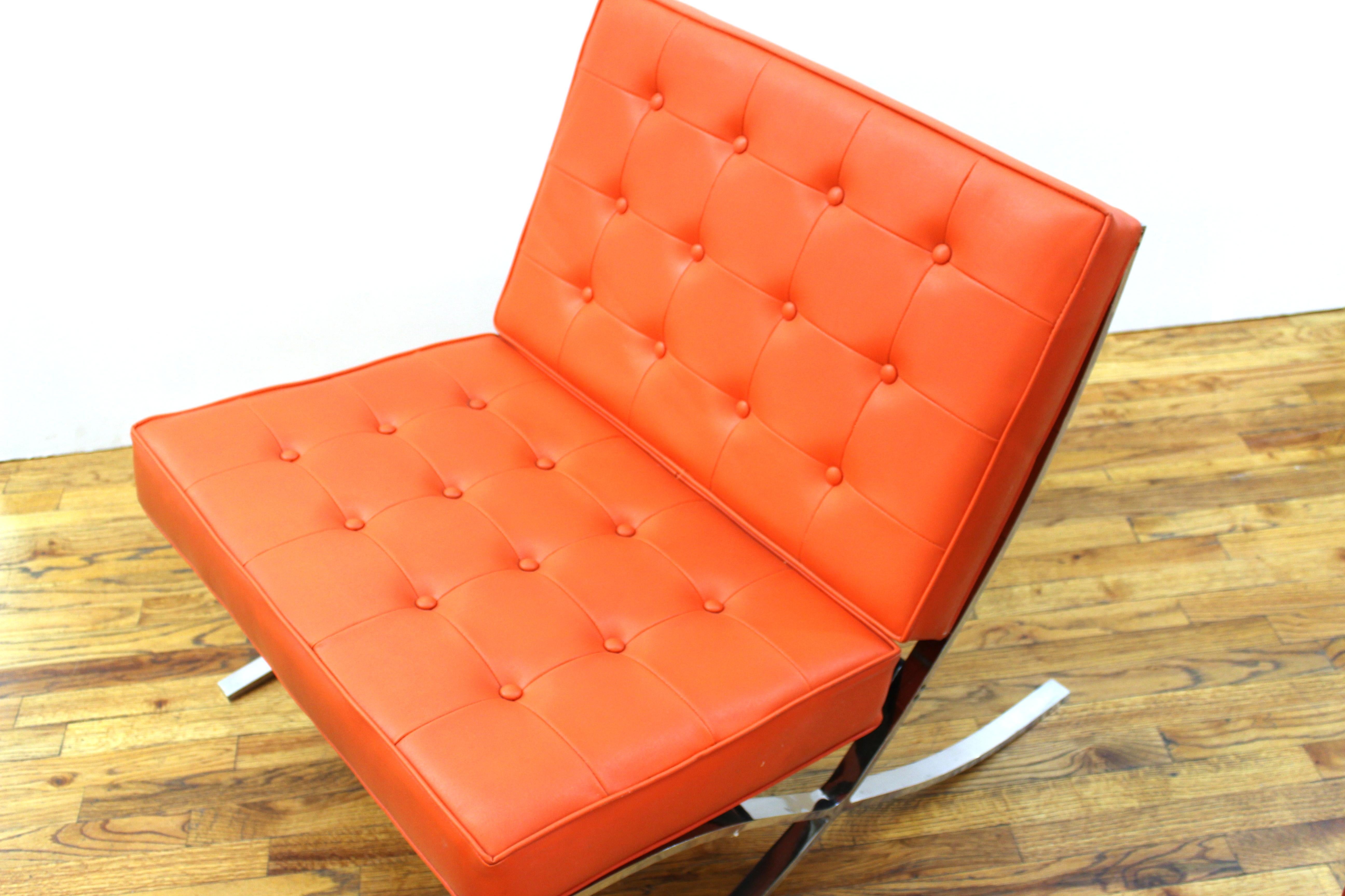 Mid-Century Modern Barcelona lounge chair after Mies van der Rohe, with chromed metal structure assembled with hex key joints and orange upholstered seating, unmarked, likely 1970s. Measures: 32