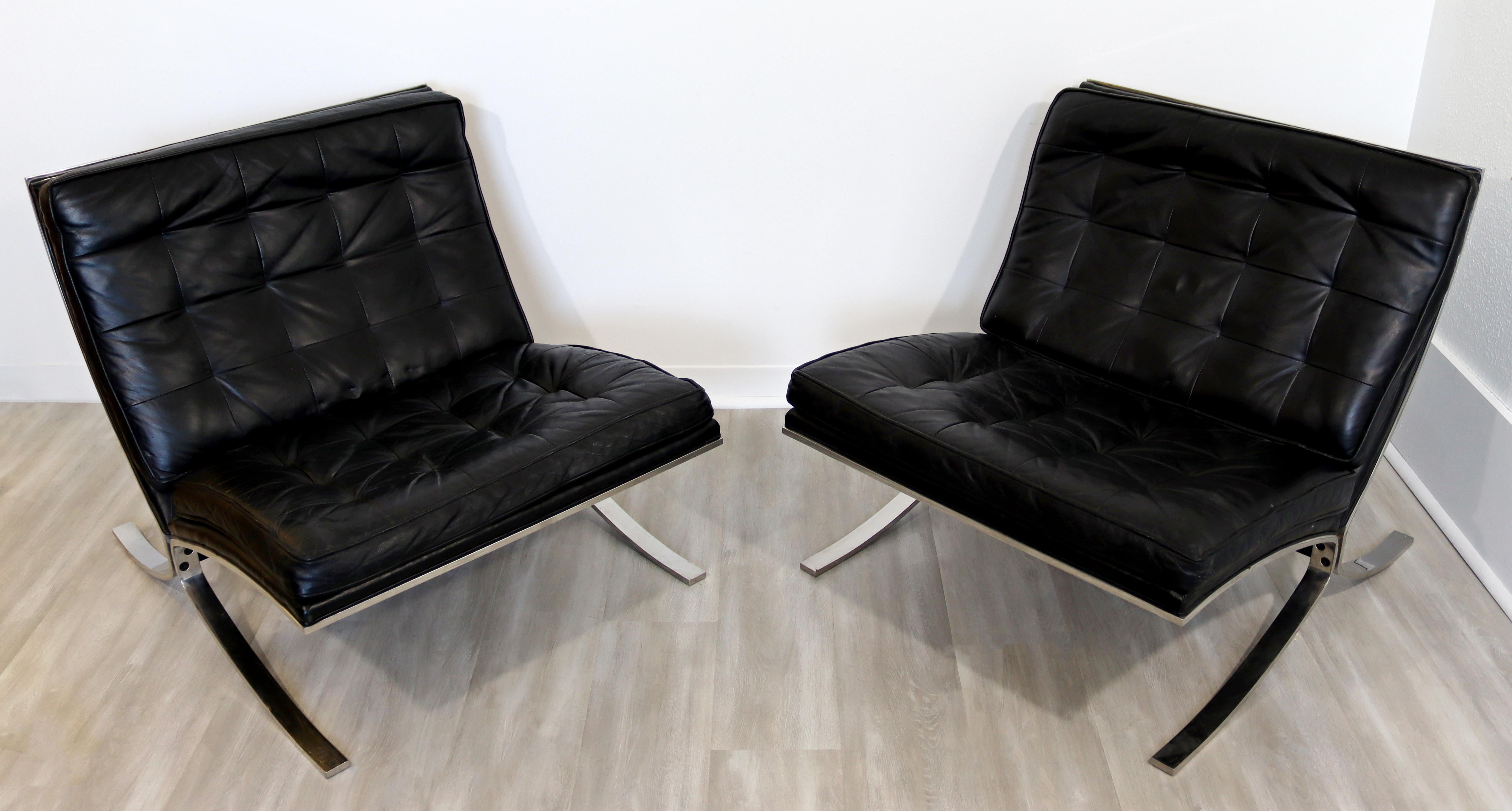 For your consideration is a lux looking pair of Barcelona style lounge chairs, by Mies Van der Rohe for Knoll style, circa the 1970s. In very good vintage condition, with some obvious ware to the leather. The dimensions are 29