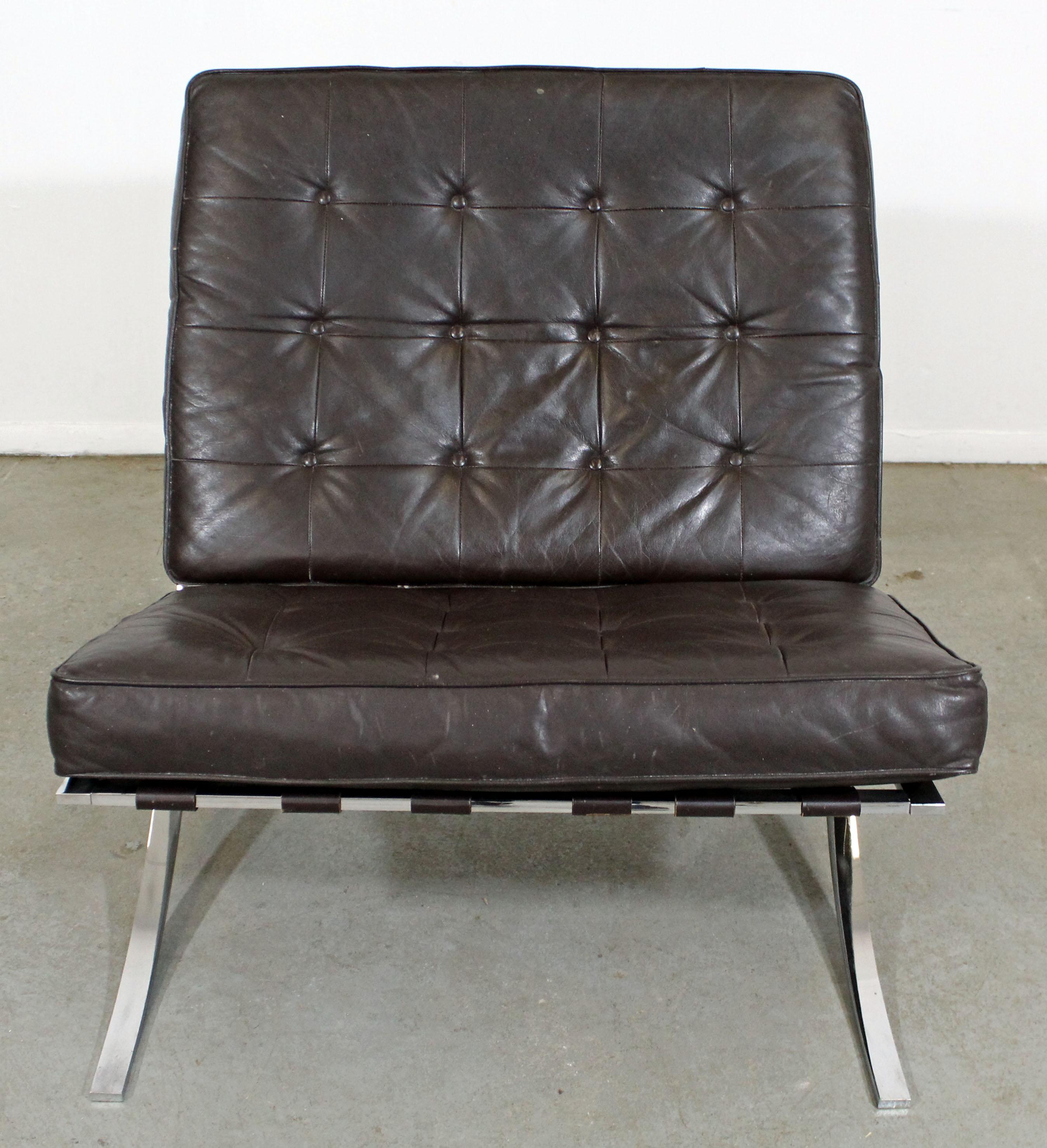 Offered is a Mid-Century Modern Barcelona style lounge chair with a chrome frame and leather cushions. It is in decent condition for its age, but needs reupholstering (wear on upholstery, strapping is usable, scratches/wear on chrome; see pictures).