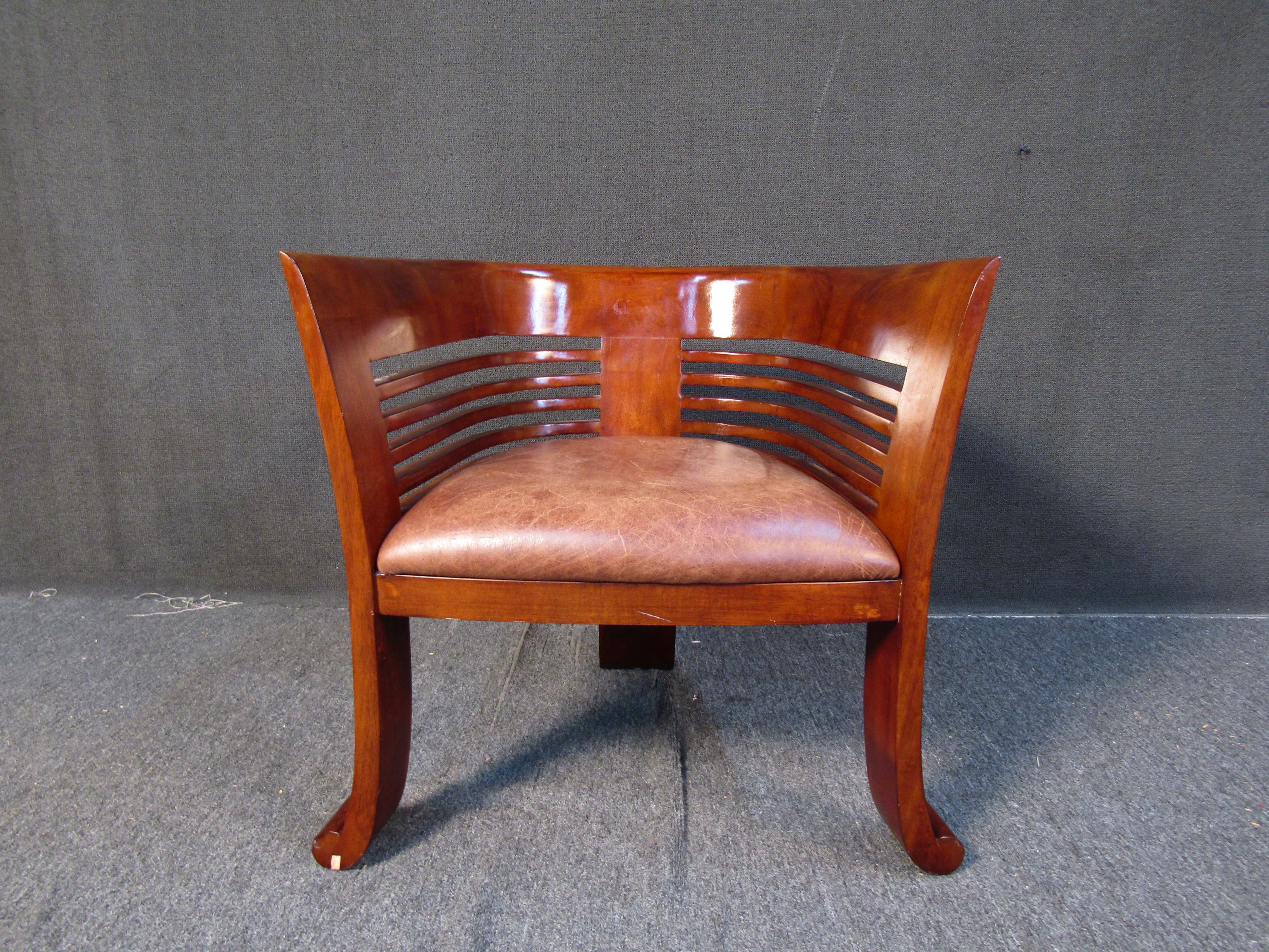 Nice vintage Mid-Century Modern barrel backed wooden armchair with a leather seat. Please confirm item location with seller (NY/NJ).