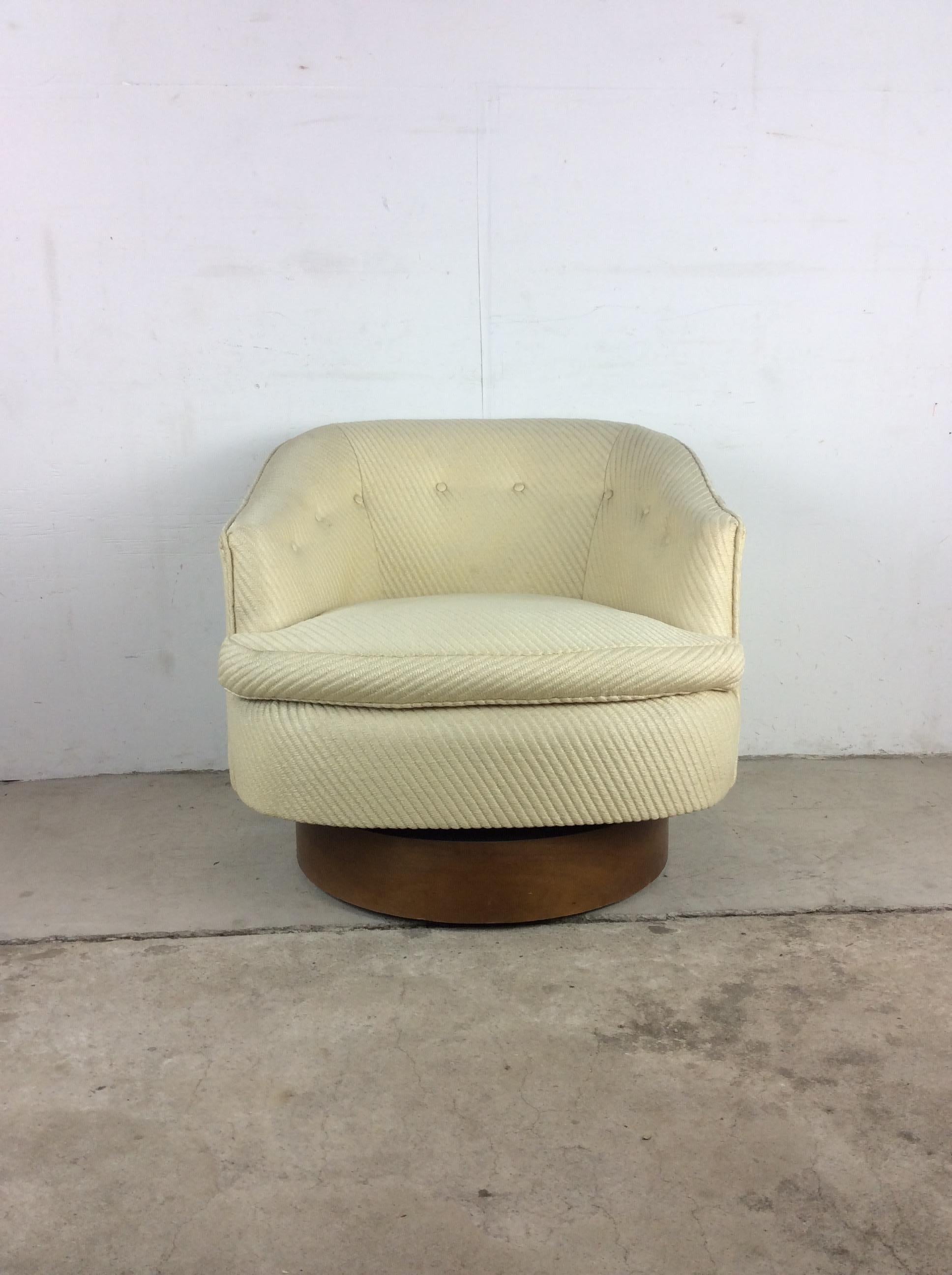 This mid century modern barrel back club chair features vintage white twill upholstery, tufted seat backs, removable seat cushion, and swivel base with walnut veneer.

Dimensions: 28w 30d 15.5sh 21ah 26.5h 


