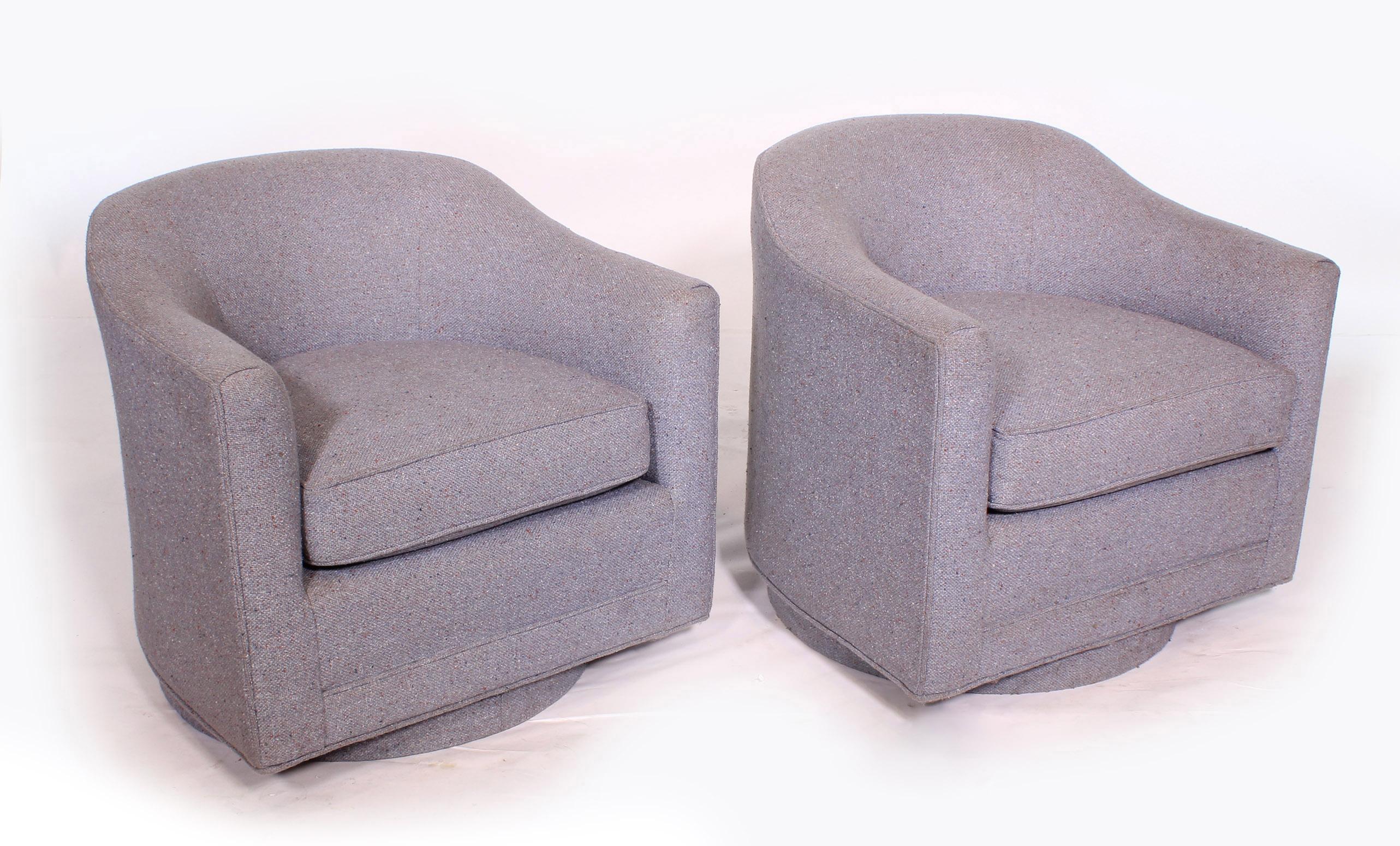 Pair of vintage Mid-Century Modern barrel/tub swivel chairs in the style of Thayer Coggin - Milo Baughman. Chairs were used in the waiting room at the Philip Morris company. Original label has been replaced as chairs have been reupholstered. Some