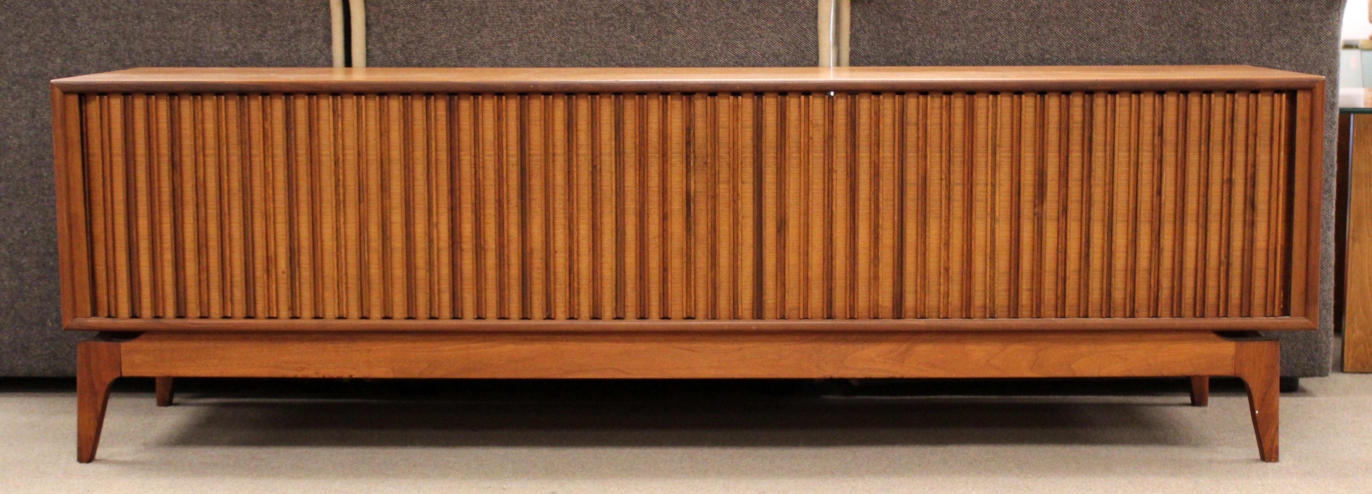 For your consideration is a terrific, walnut wood credenza sideboard, with tambour doors, by Barzilay, circa 1960s. In excellent vintage condition. The dimensions are 72