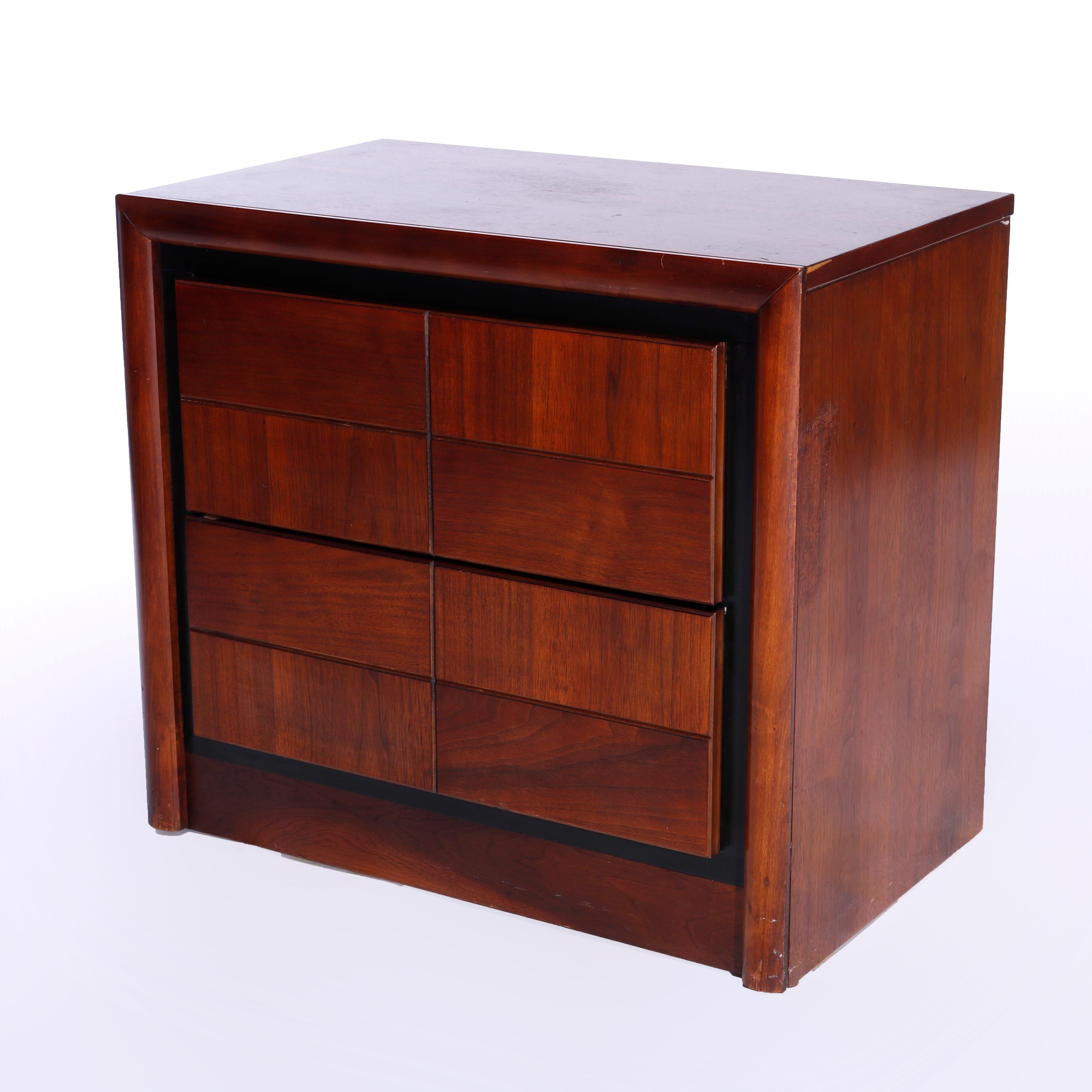 A Mid-Century Modern low chest by Bassett offers two long drawers with bookmatched mahogany parquetry facing and ebonized bordering, Glen Walnut stenciled on back, 20th century

Measures - 23'' H x 26'' W x 15.75'' D.

Catalogue Note: Ask about