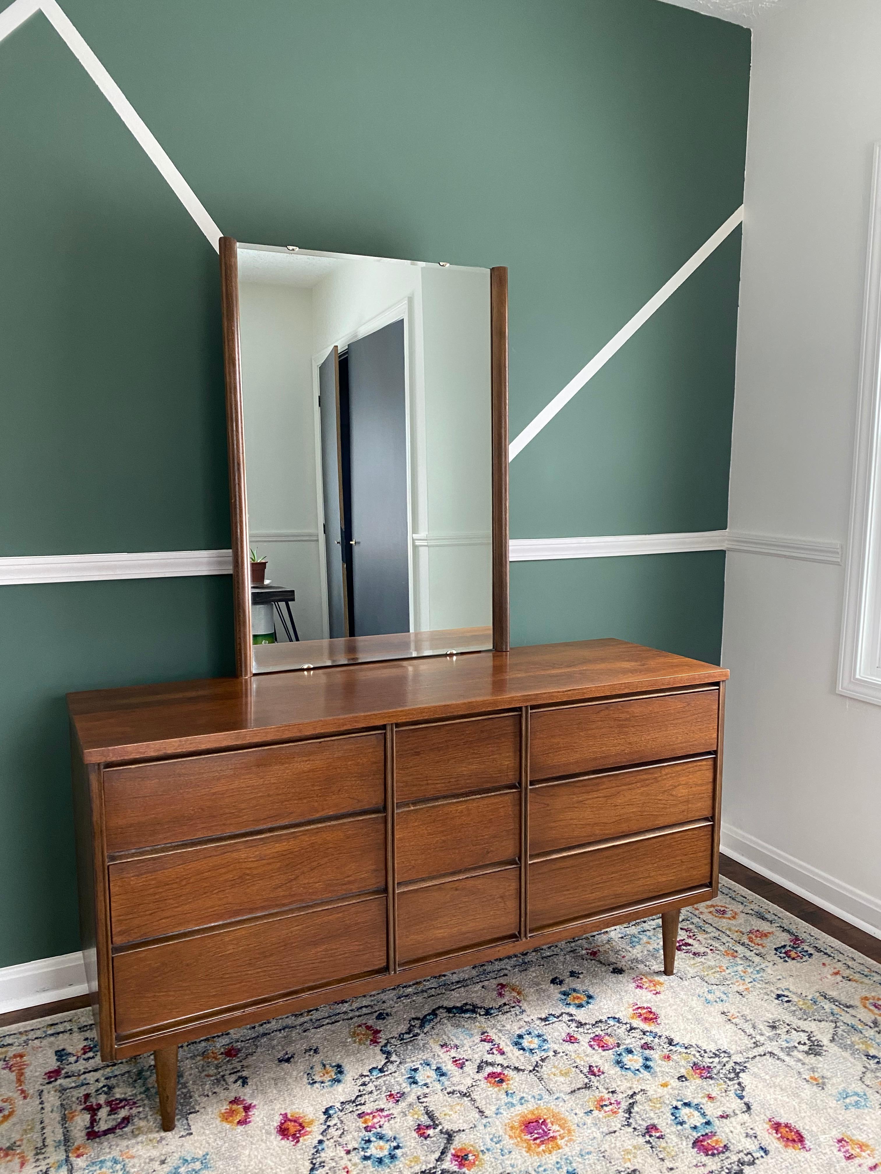 Beautiful 9 drawer mid-century modern Bassett Fanfare low-boy dresser with tall mirror. 9 drawers include 6 large and 3 smaller drawers. All drawers function really well, no chips or dents. Have stayed with one original owner since the beginning of