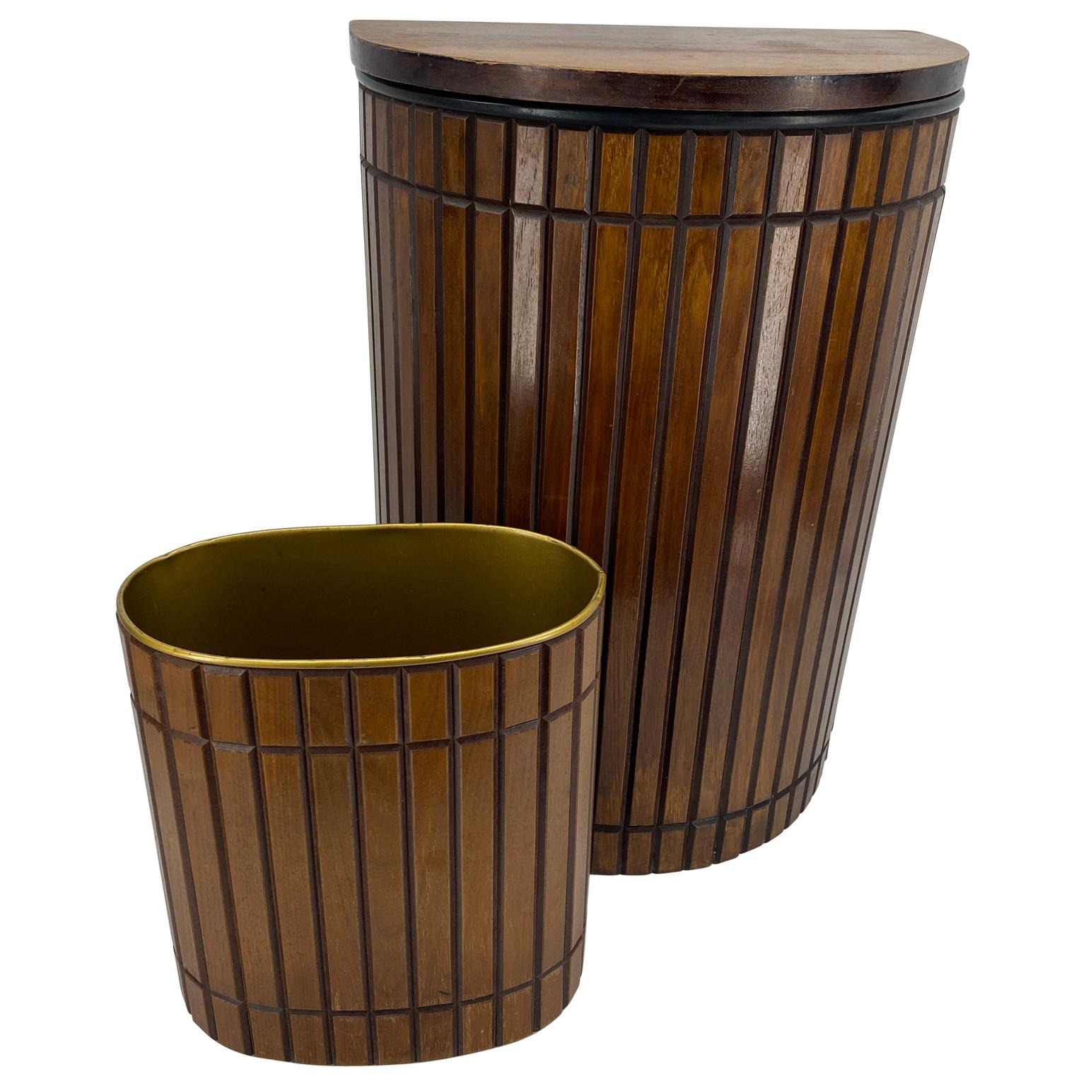 Mid-Century Modern wood hamper and trashcan set. This classic Mid-Century Modern bathroom accessory pair is walnut with black metal accents. The hamper has a lid and is lined in white metal. All original, the stylish set is as functional as it is