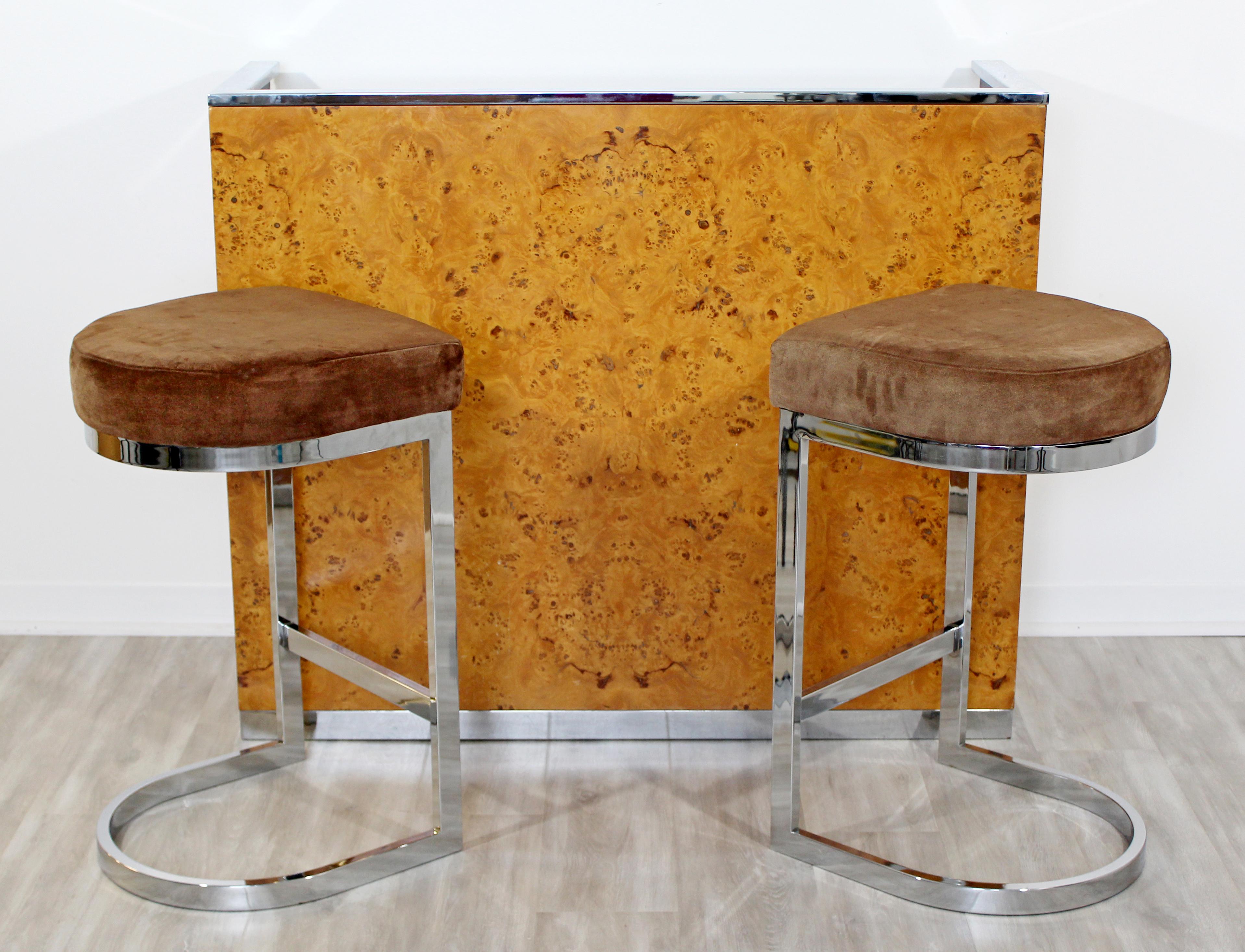 For your consideration is a beautiful, burl wood, chrome and black lacquer bar, with a pair of matching cantilever chrome bar stools, by Milo Baughman, circa 1970s. In very good vintage condition. The dimensions of the bar are 48