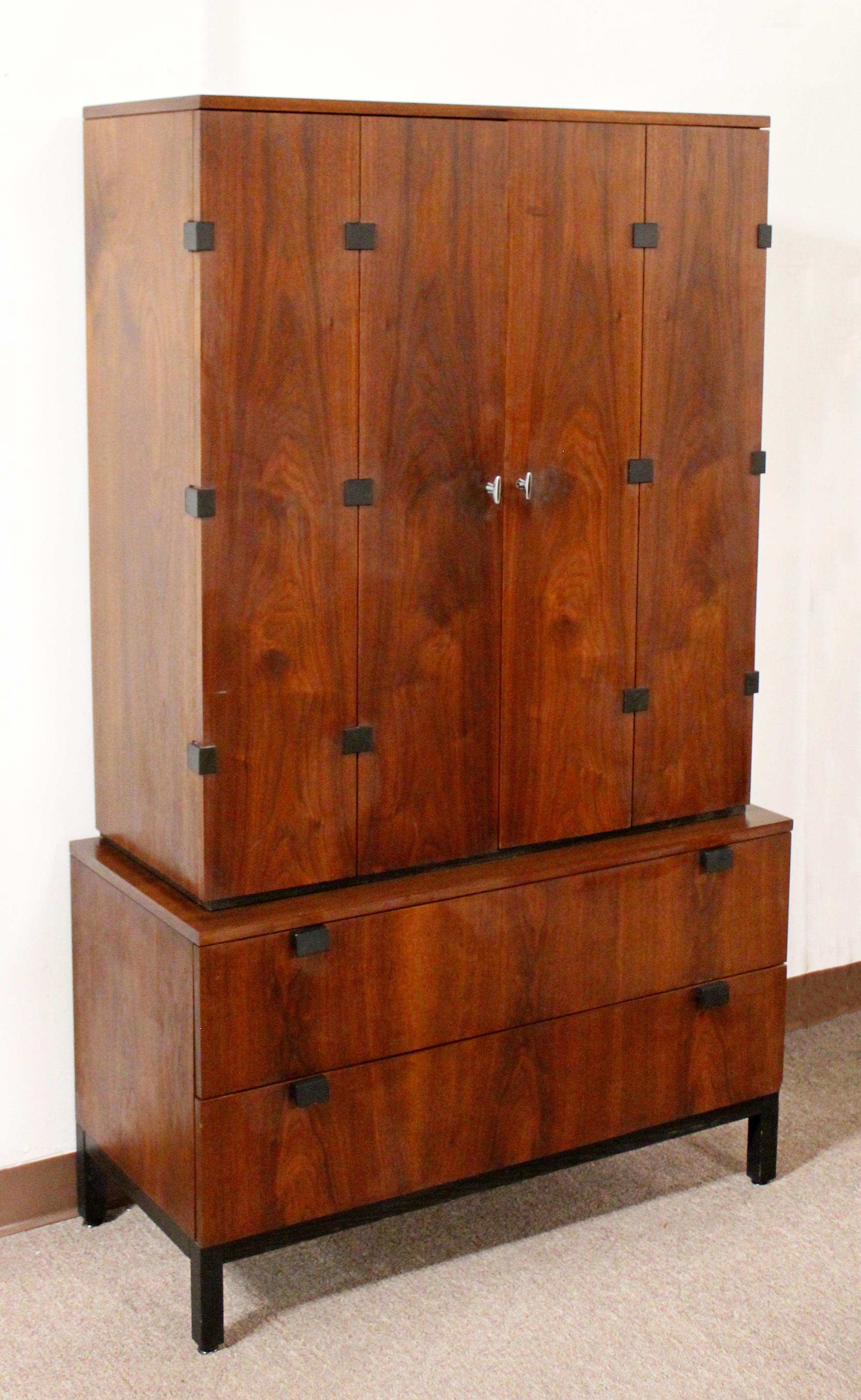 For your consideration is a fantastic walnut wood armoire wardrobe unit, by Milo Baughman for Directional, circa 1970s. In excellent vintage condition. The dimensions are 40