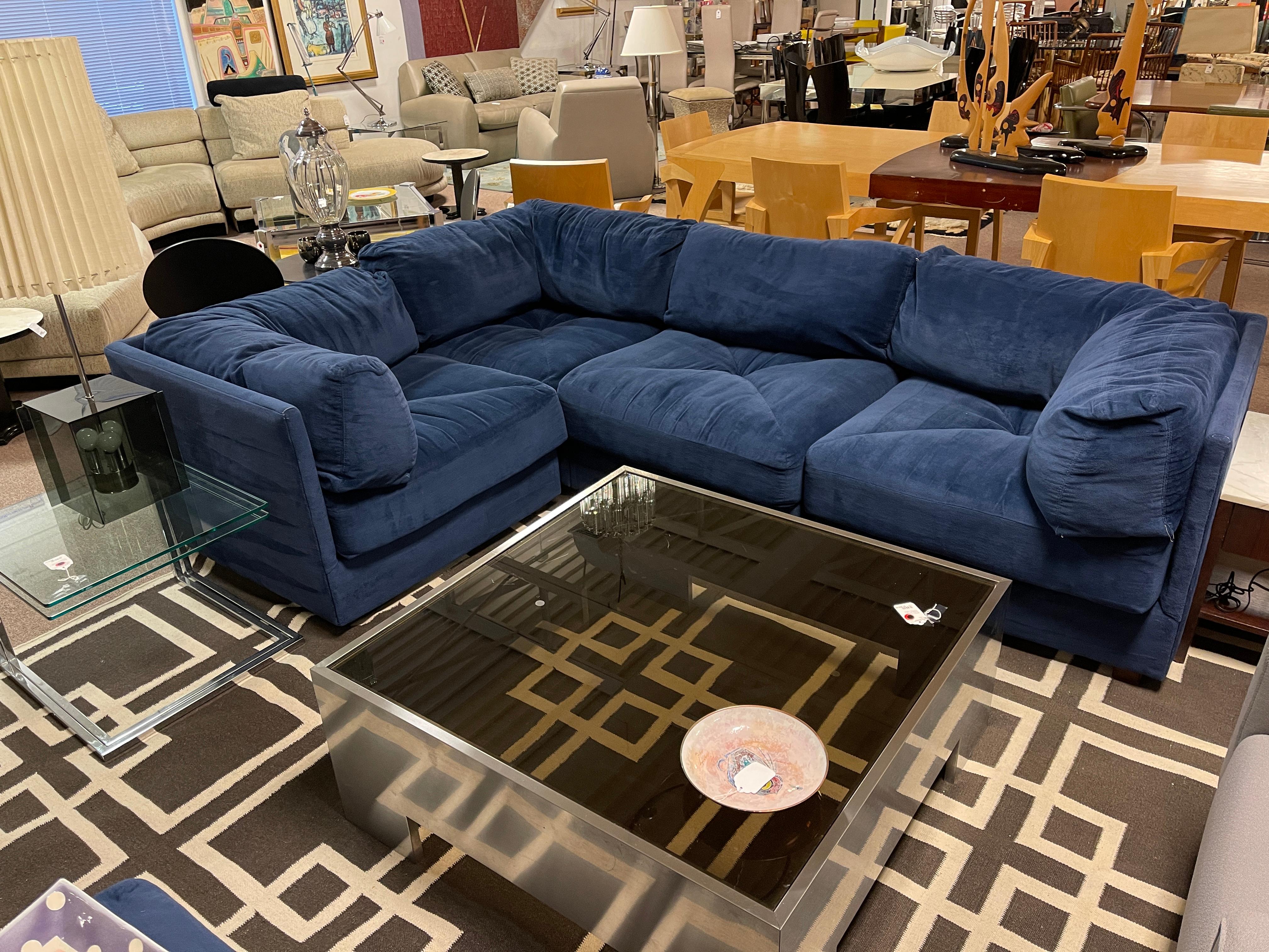 For your consideration is a modular, four piece sectional sofa, with an ottoman, upholstered in rich, blue velvet, by Milo Baughman, circa 1980s. In excellent vintage condition, color looks less vibrant in the pictures, the true color is royal blue.