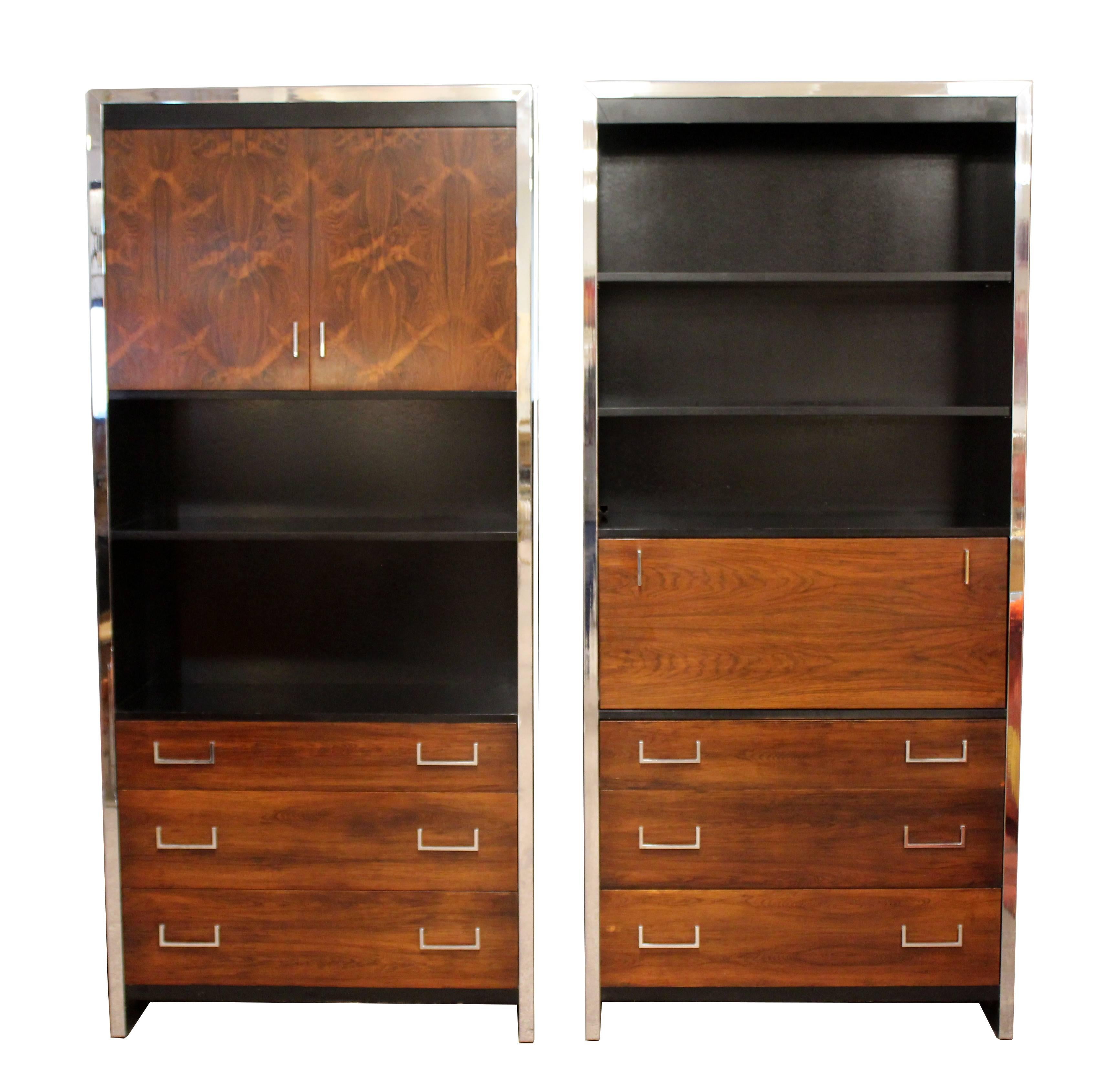 For your consideration is an incredible rosewood, chrome and black lacquer pair of cabinet shelving units and desk set, by Milo Baughman for John Stuart Inc, circa 1960s. The stunning campaign desk features two spacious rosewood drawers, with chrome