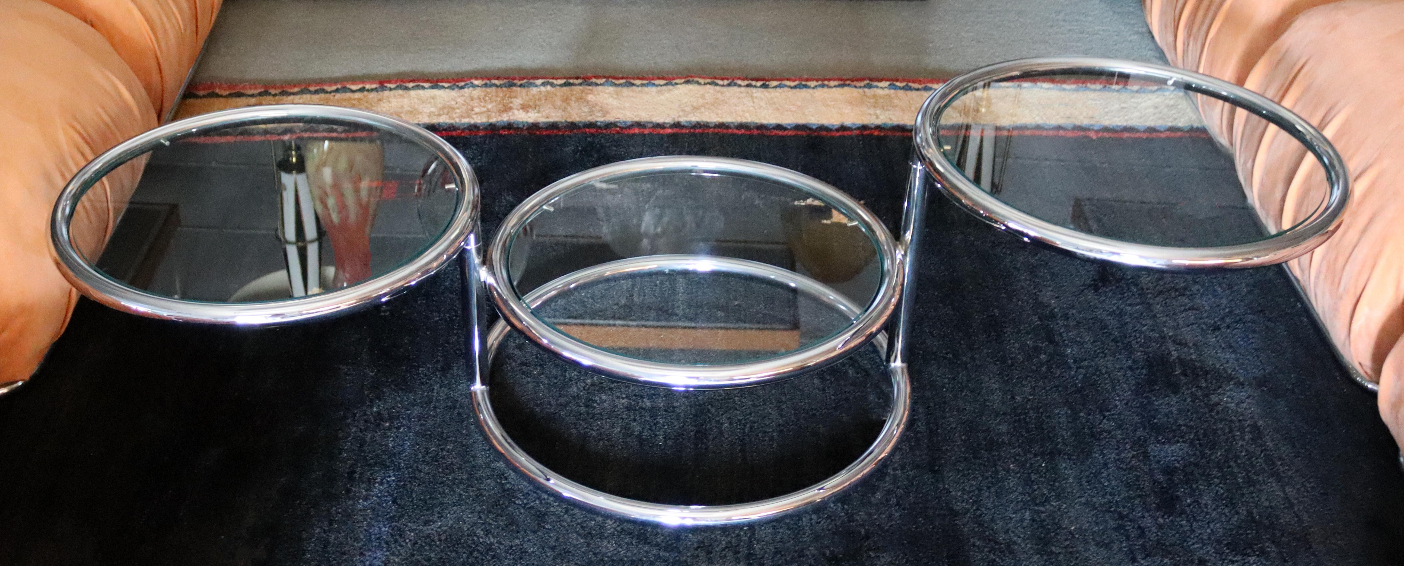 For your consideration is a terrific, three tier coffee table, with glass tops on adjustable chrome bases, by Milo Baughman, circa the 1970s. In excellent vintage condition. Each circle top measures 22