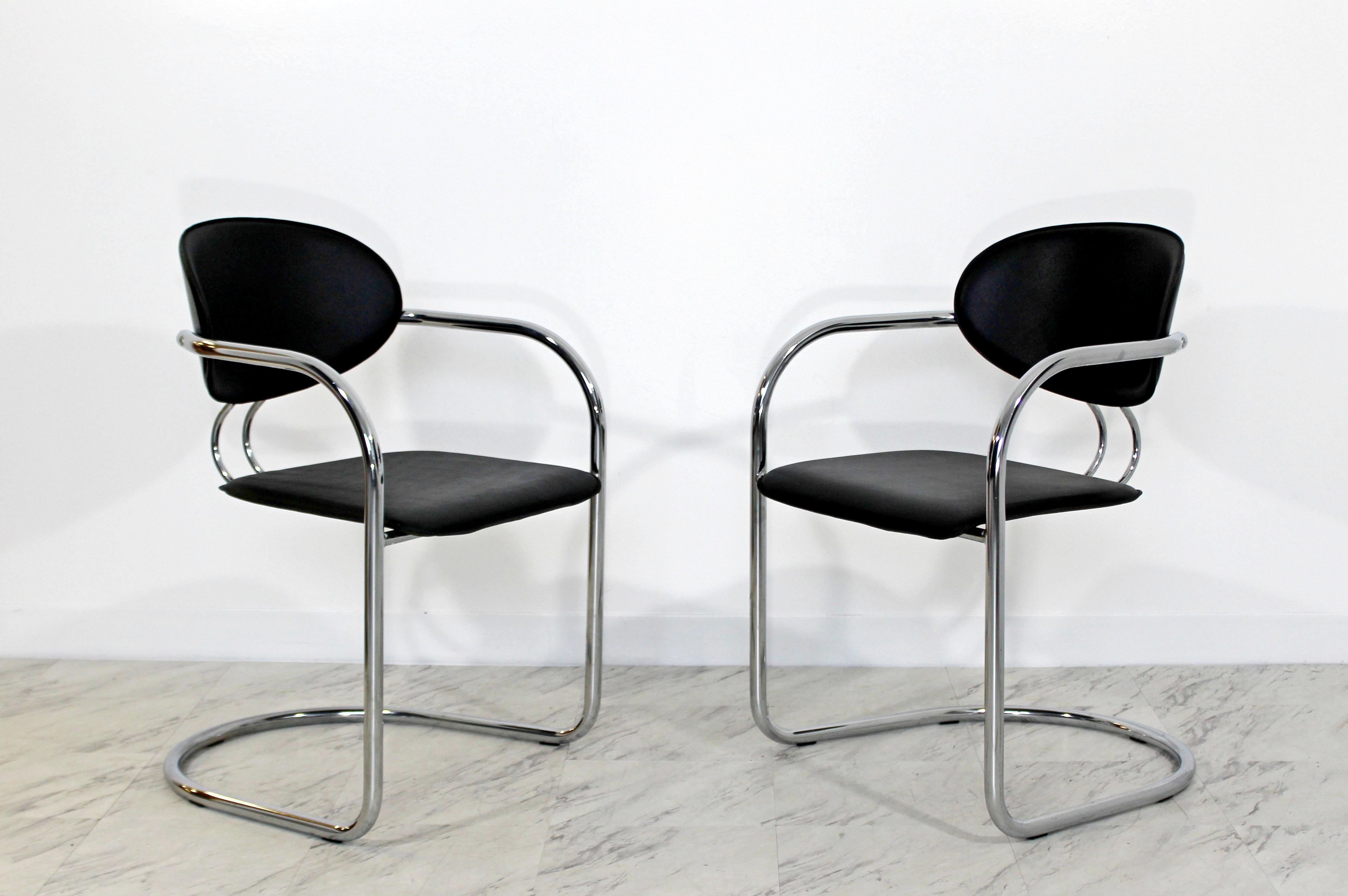 For your consideration is a phenomenal set of six, cantilever chrome and black leather, dining armchairs, by B&B Italia, made in Italy, circa the 1970s. In excellent condition. The dimensions are 22