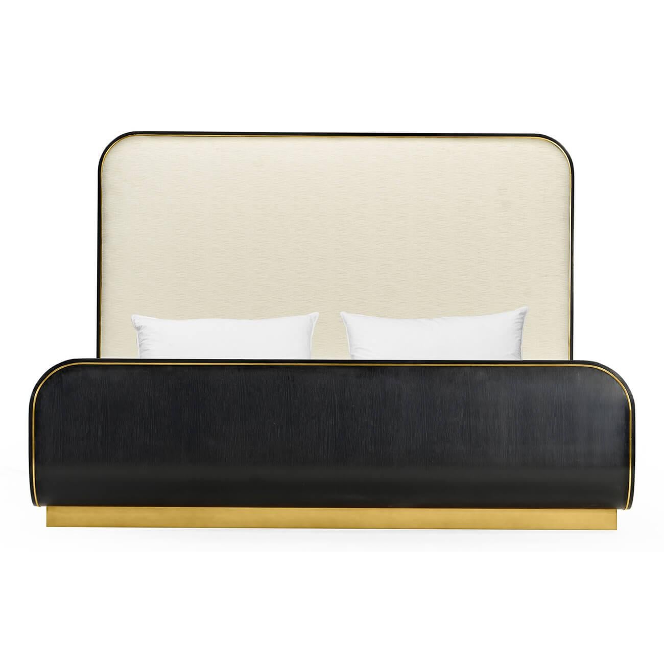 A Mid-Century Modern style king size bed with an ebonized oak frame with curved ends, brass trim and brass-mounted plinth base, and upholstered headboards and side rails.

Dimensions: 83 1/8
