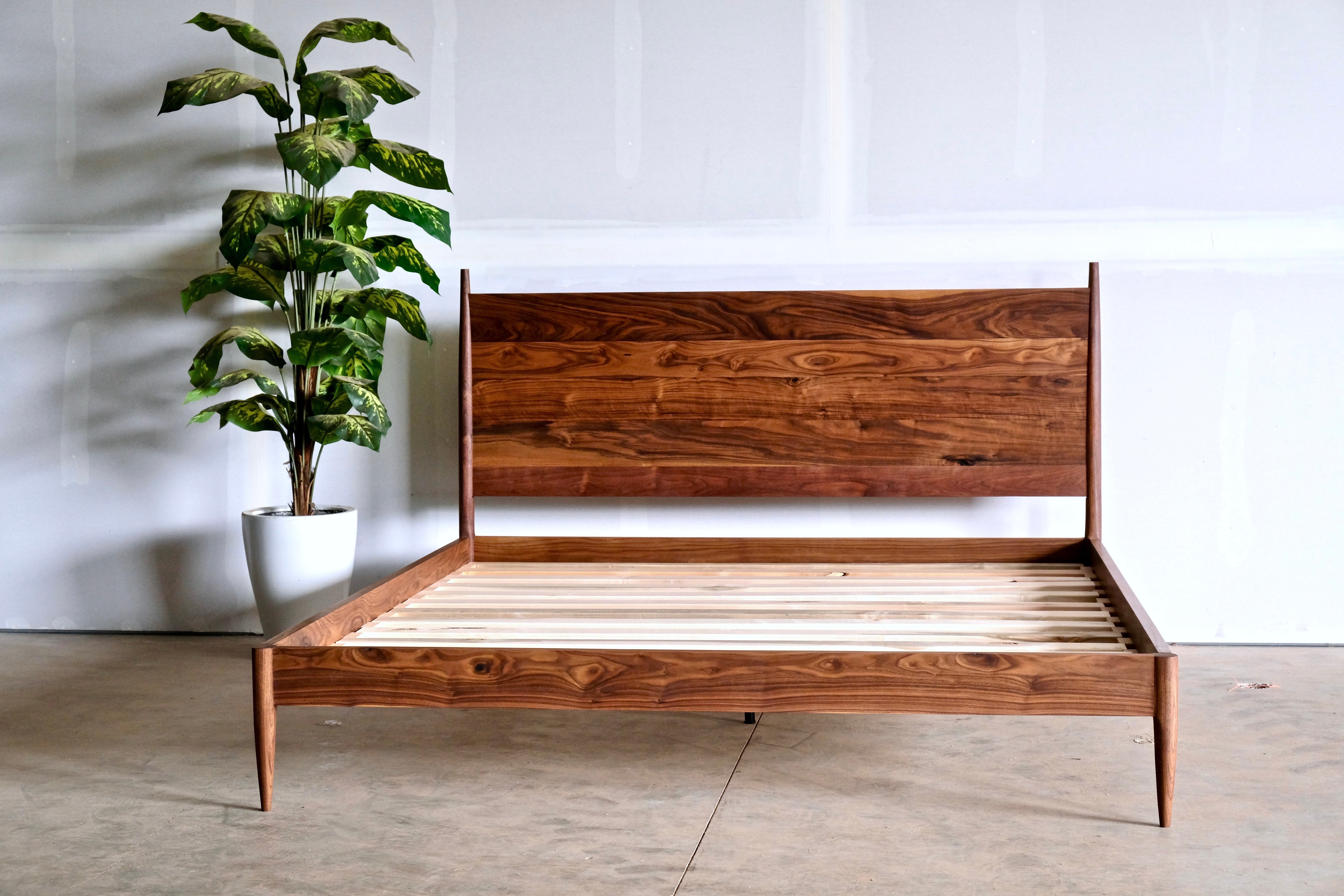 Bed No. 4.5

This is a modern take at a classic and timeless shaker shape. Turned tapered legs fit seamlessly into our solid wood headboard and footboard panels.

WOOD TYPE
Pictured: Walnut
Available in any domestic hardwood including Walnut, Maple,