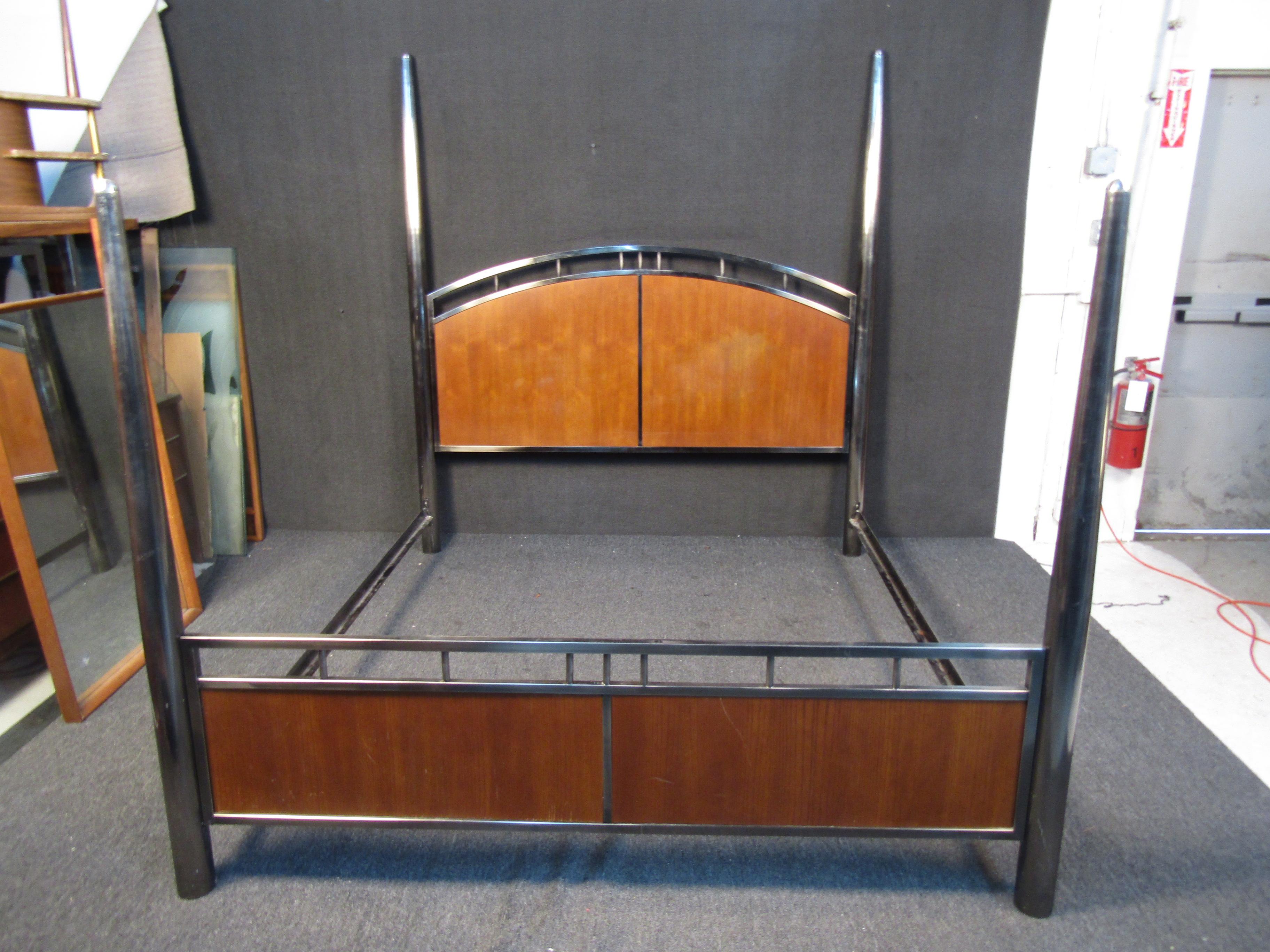 This impressive bed frame set by Mastercraft features tall bedposts and contrasting materials for a unique Mid-Century Modern look. Please confirm item location with seller (NY/NJ).