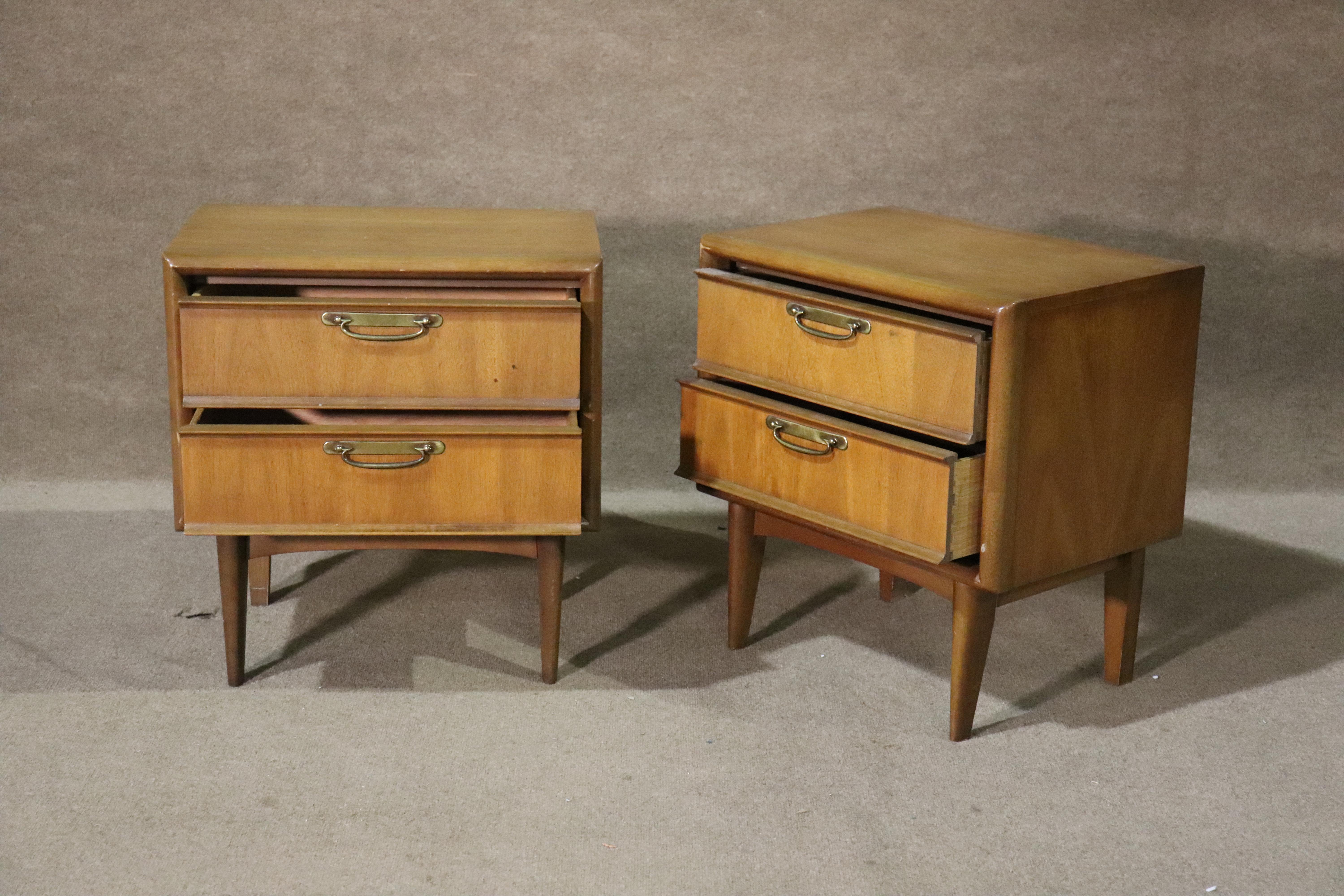 Pair of mid-century walnut end tables with two drawers and brass hardware.
Please confirm location NY or NJ