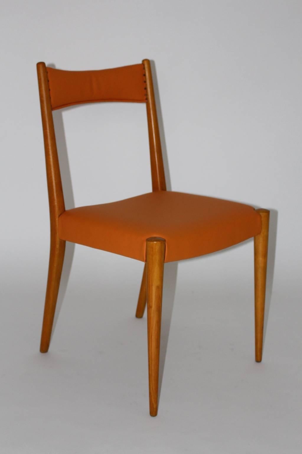 Mid century modern vintage beech orange ten ( 10 ) dining chairs or chairs  designed by Anna Lülja Praun, Vienna 1953 and executed by Wiesner - Hager. 
These ten dining chairs stand out through its minimalistic design features, which assimilated