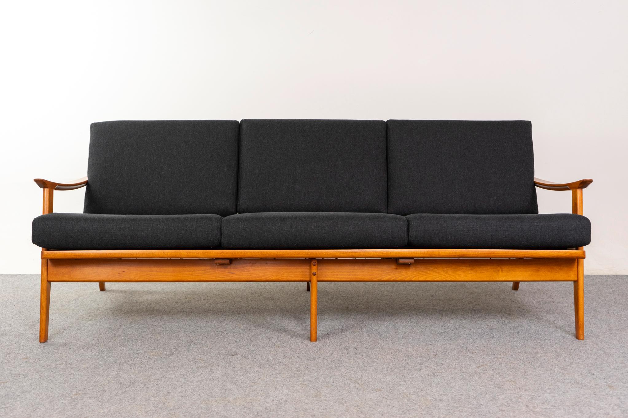 Beech mid-century modern sofa, circa 1960s. Solid beech wood frame with lovely lines and a golden hue. New, quality wool & flax charcoal grey upholstery. Timeless elegance!  