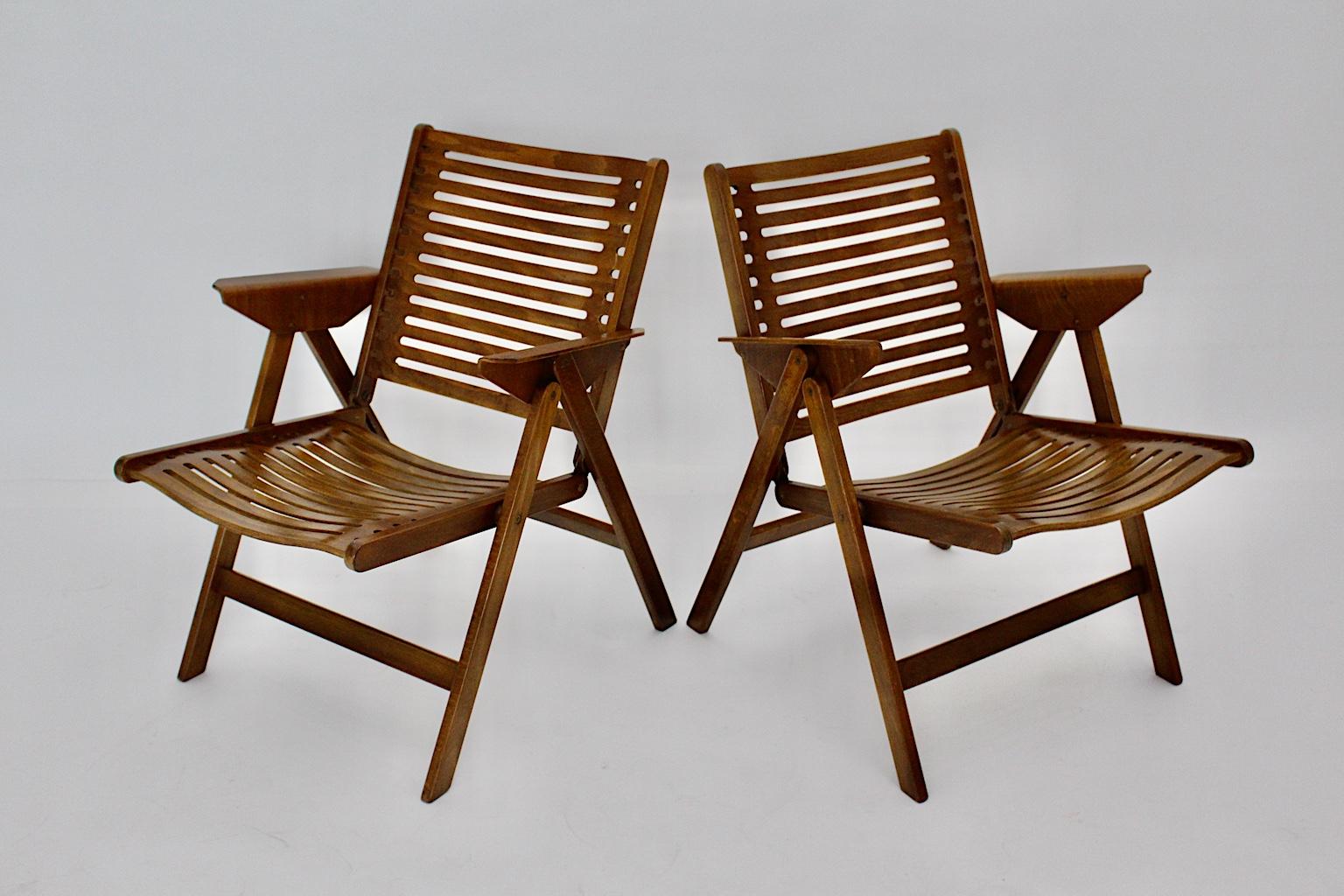 Mid century Modern  pair of vintage armchairs designed by Niko Kralj, which are foldable!
Niko Kralj (1920-2013)
This presented pair of Rex chairs are great design pieces and exhibited in the Museum of Modern Art in New York City as well as the