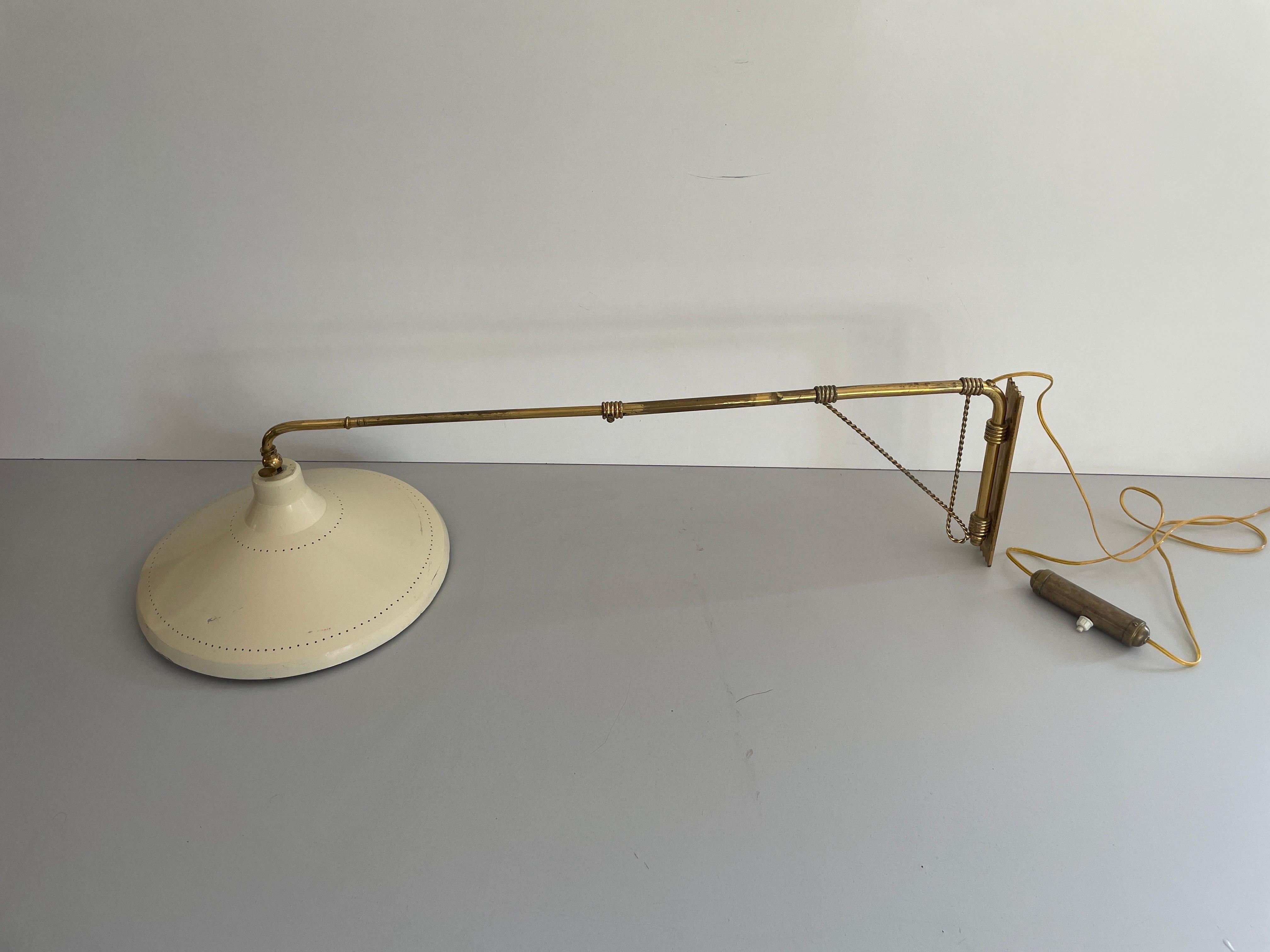 Mid-Century Modern Beige Brass Wall Lamp, 1950s, Italy

Very elegant and Minimalist wall lamps.

Lamps are in excellent condition.

These lamps works with E27 standard light bulbs. 
Wired and suitable to use in all countries. (110-220