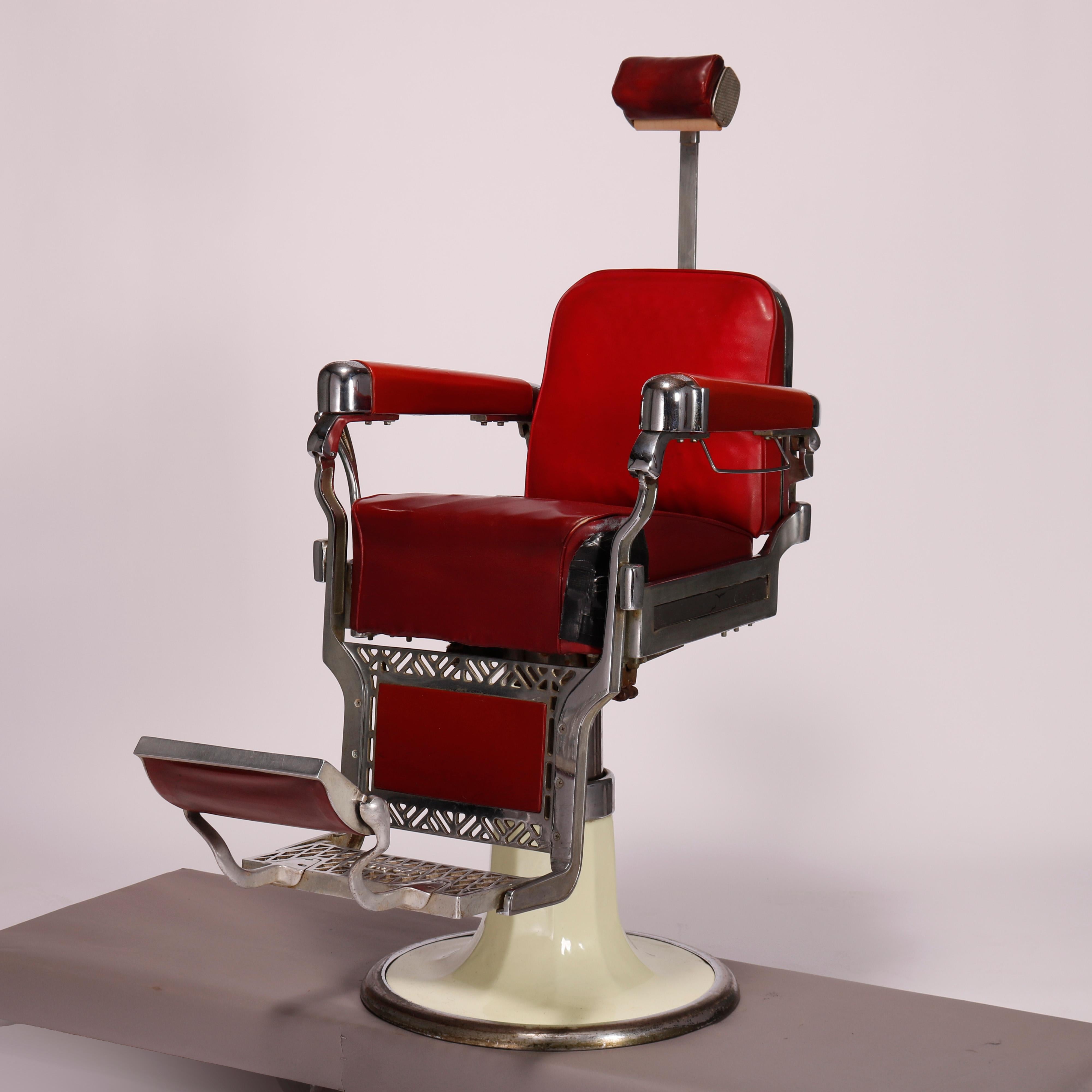 A vintage deco barber chair by Belmont offers chrome, frame with vinyl upholstery, raised on enameled cone form base, maker label as photographed, c1950

Measures - 58.5''H x 29.75''W x 47''D.

Catalogue Note: Ask about DISCOUNTED DELIVERY RATES
