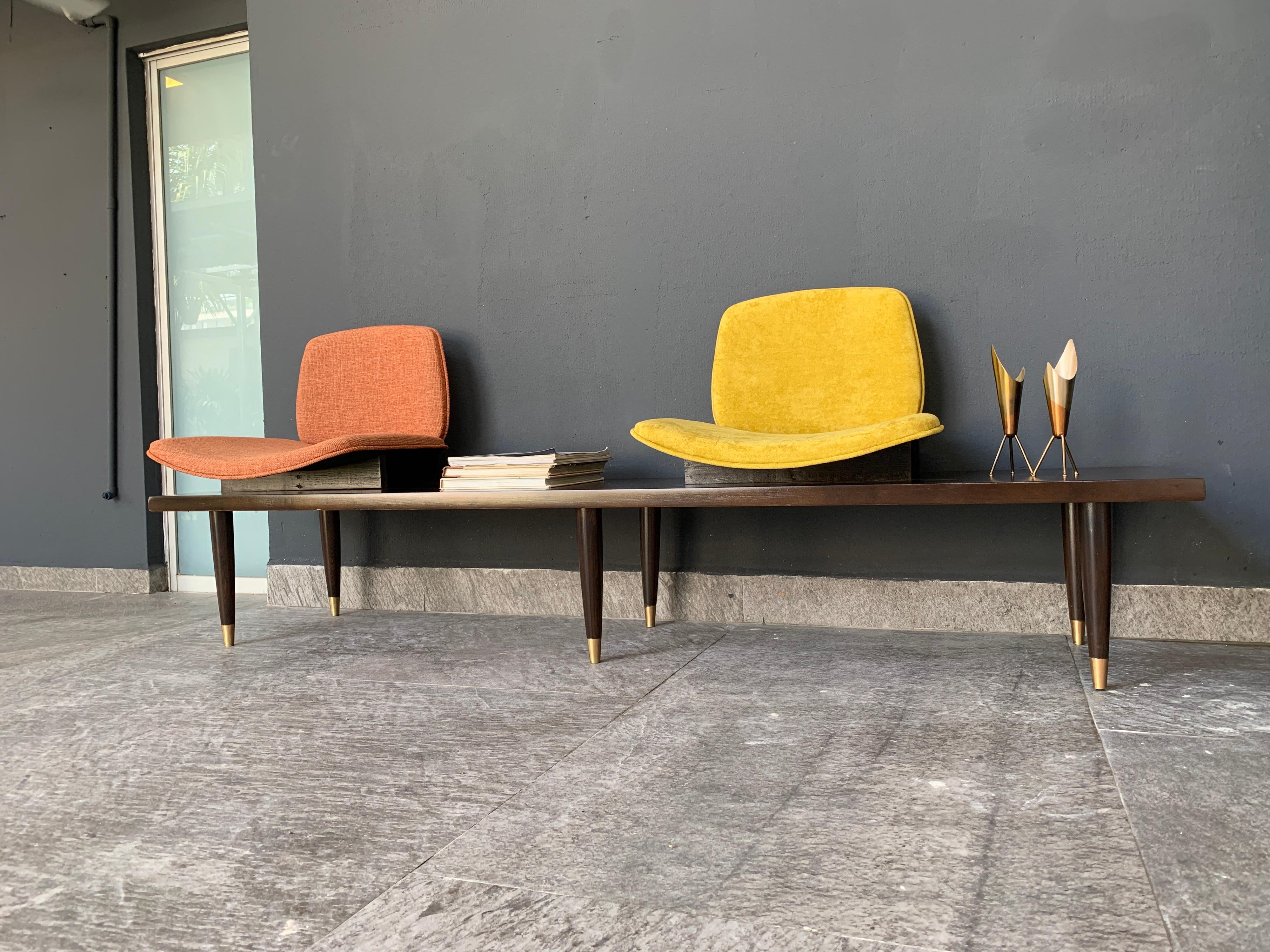 Modern bench 180 cms long, originally it had three seats but we decided to leave only two. The piece was in the waiting room of a renowned architectural firm. Includes small square stool of 50 x 50 cm.