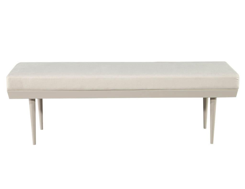 Mid-Century Modern bench. Original mid-century design, America, circa 1970’s. Masterfully restored in a light pale grey satin lacquered finish with contrasting textured off-white fabric. Sleek clean styling with tapered leg design.

Price includes