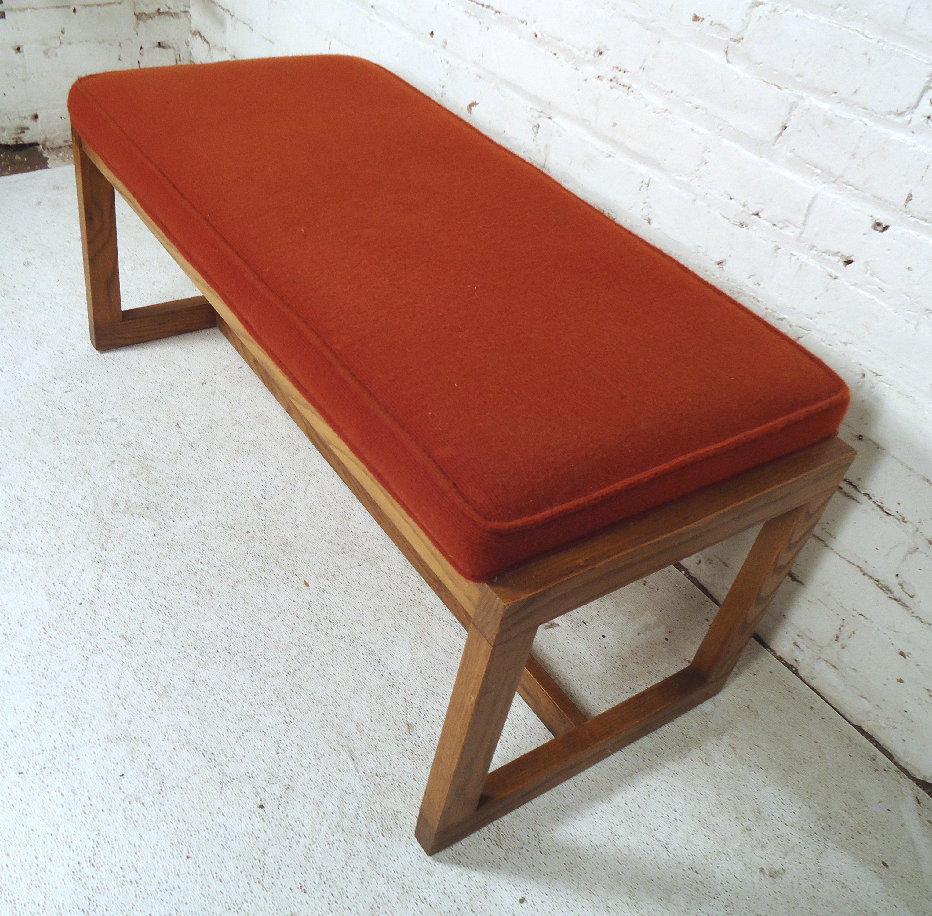 Vintage modern bench featured in orange fabric, on a set of sturdy sled legs.
(Please confirm item location - NY or NJ - with dealer).