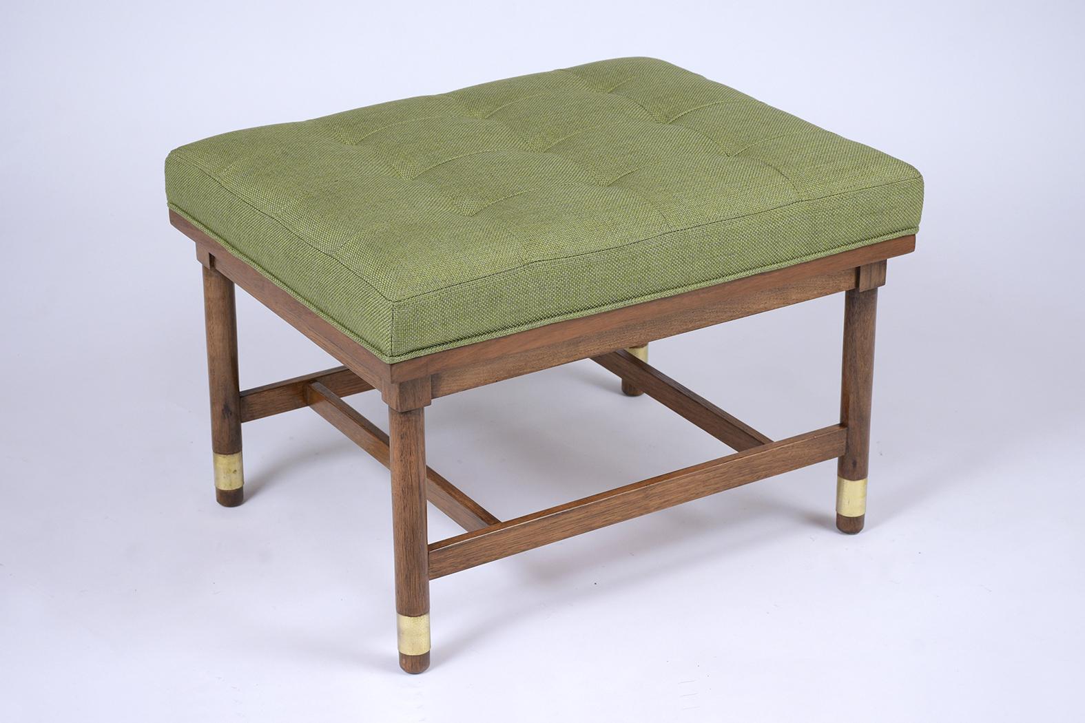 This Mid Century Modern Tufted Bench has been fully restored, made out of walnut wood and features a newly upholstered tufted cushion. This bench has its original dark walnut color stain with a newly lacquered finish, and the cushion has been