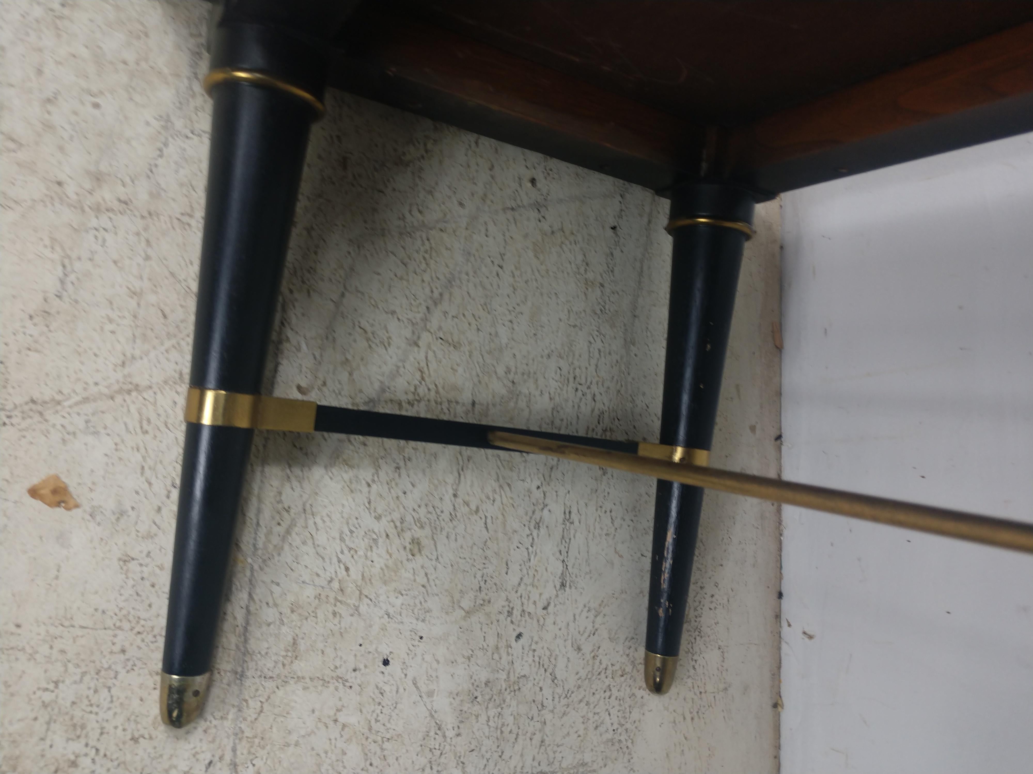 Simple and elegant form, six leg with center stretcher. Brass rod and other components connecting the legs. Long and narrow, 80 x 18 with a hgt. of 15. Shows normal wear.