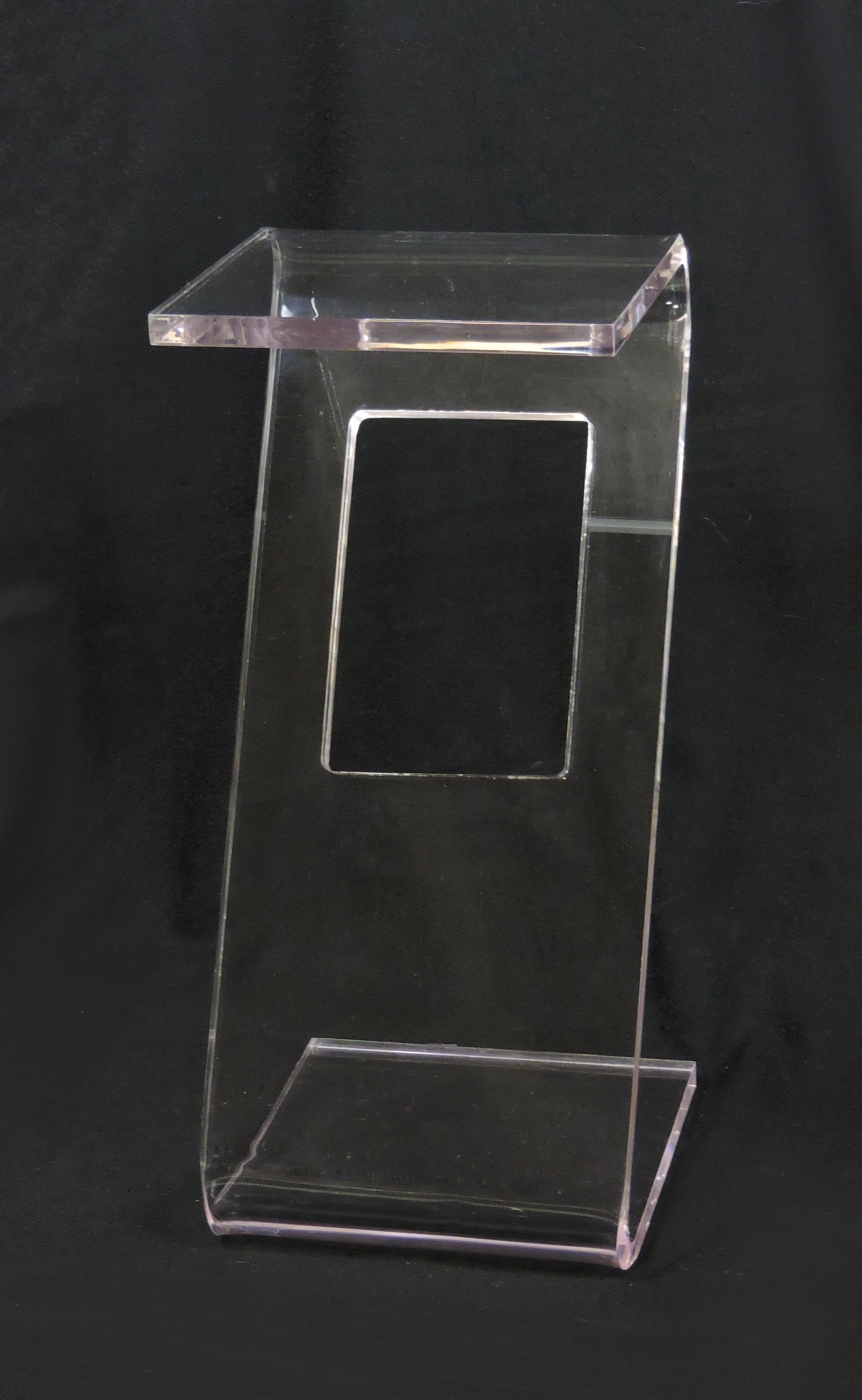Beautiful Lucite end table. This table is made of three-quarter-inch thick clear Lucite that is bent into a Z shape and has a rectangular cutout in the center. Sturdy and well made, great for small spaces.