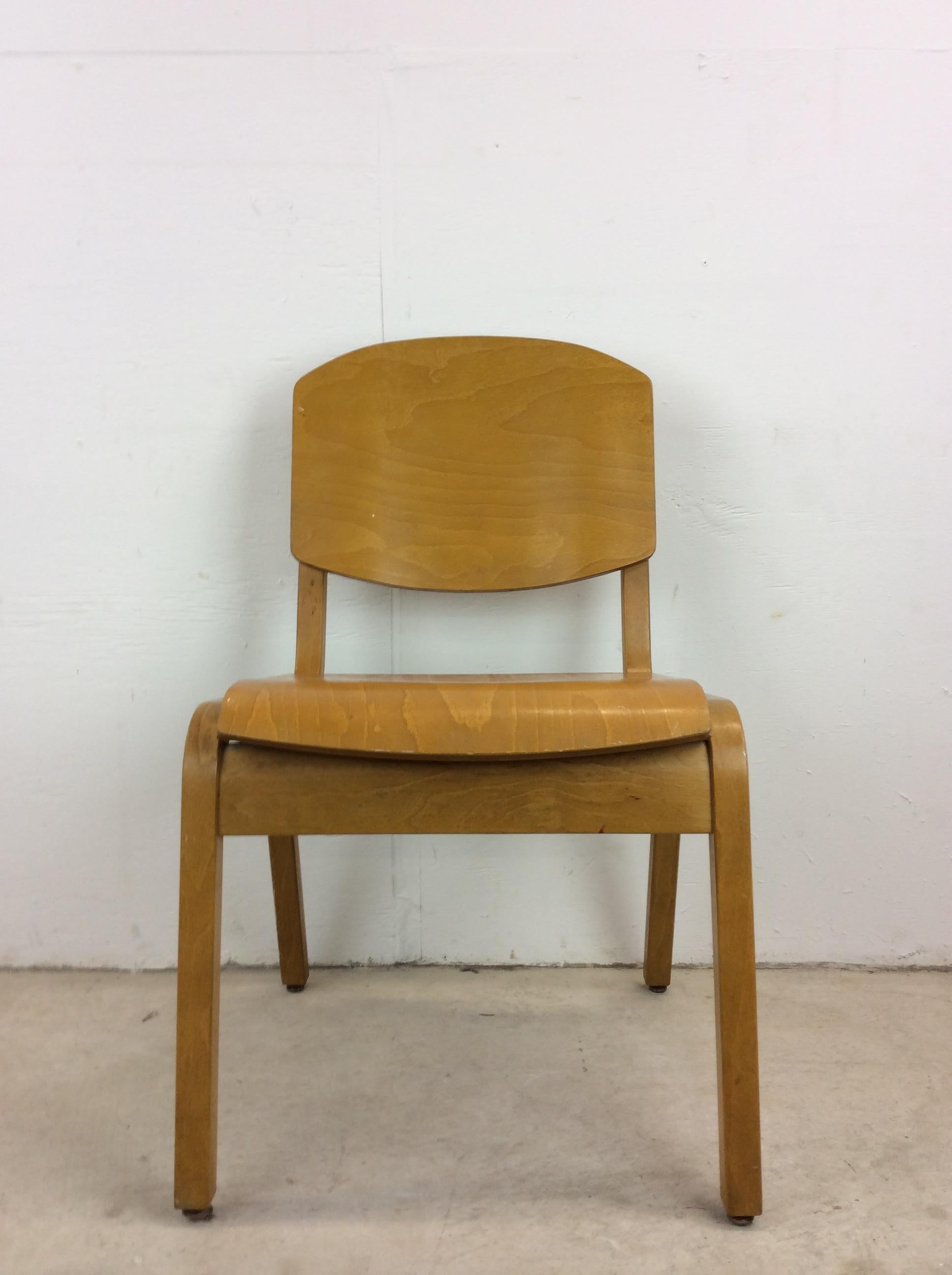 This mid century modern side chair by Tecta Furniture features unique plywood construction, original maple finish, bentwood seat and back with tall tapered legs.  Similar in style to Heywood Wakefield but I am told this is designed by Stafford for