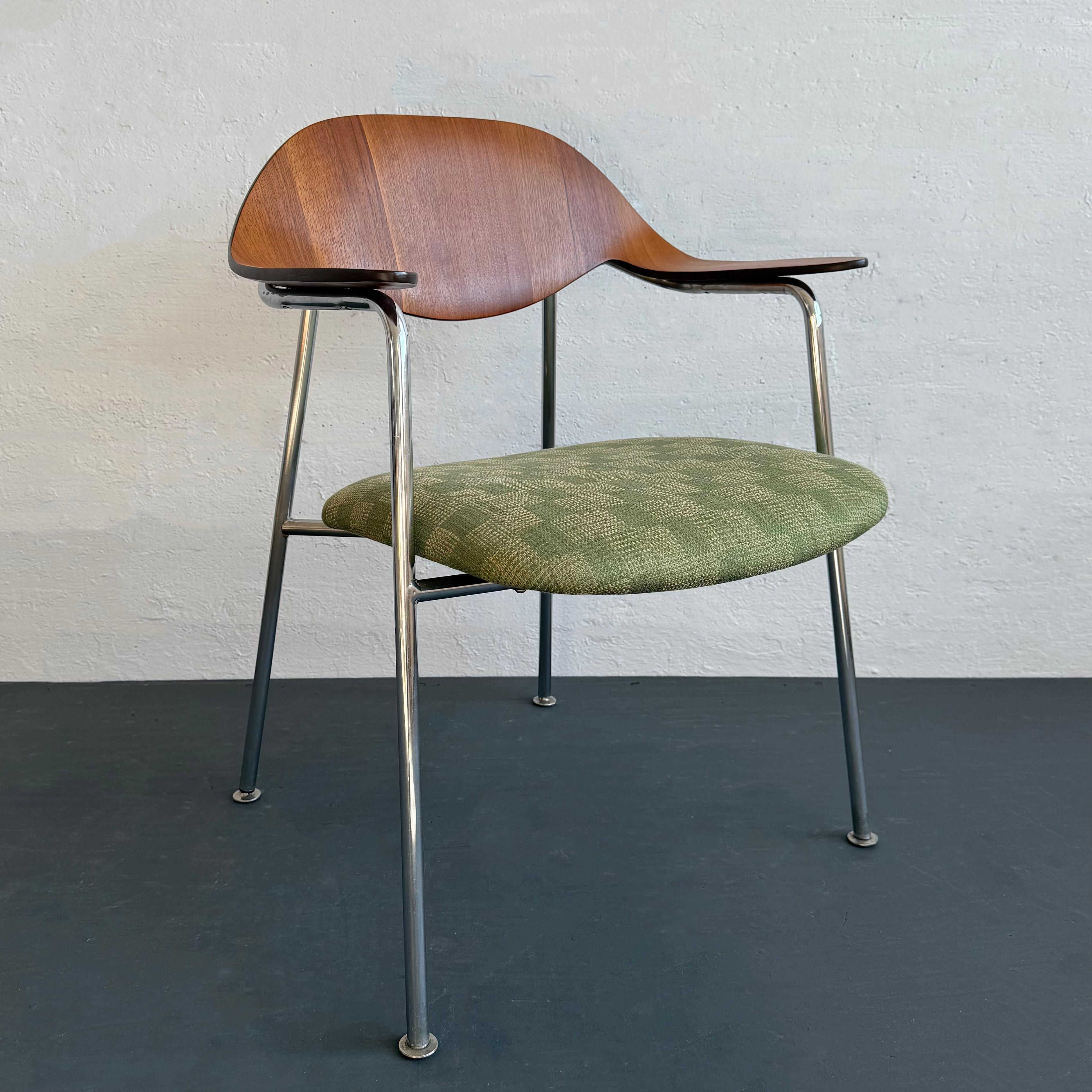 This Mid-Century Modern armchair was designed by American designer George Mulhauser, circa 1964, for a competition to furnish the TWA building at John F. Kennedy airport. While he didn't win, the chair went into a very limited production,
