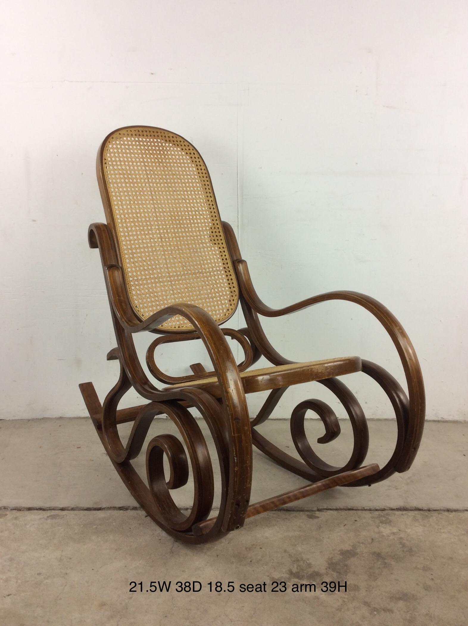 This vintage rocker in the style of Thonet features unique bentwood frame with caned seat and seat back.  Complimentary cafe chair & ottoman available separately.

Dimensions: 21.5w 38d 39h 23h 18.5sh

Condition: The finish is in good vintage