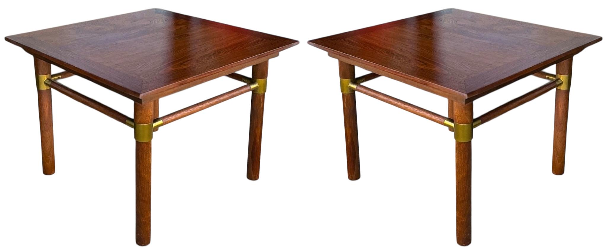 This is a pair of mid-century modern low profile side tables by Bert England. They are rosewood with bands of rosewood and brass joints. They are in very good condition. These were likely done for Johnson Furniture. They date to the 1960s. 
