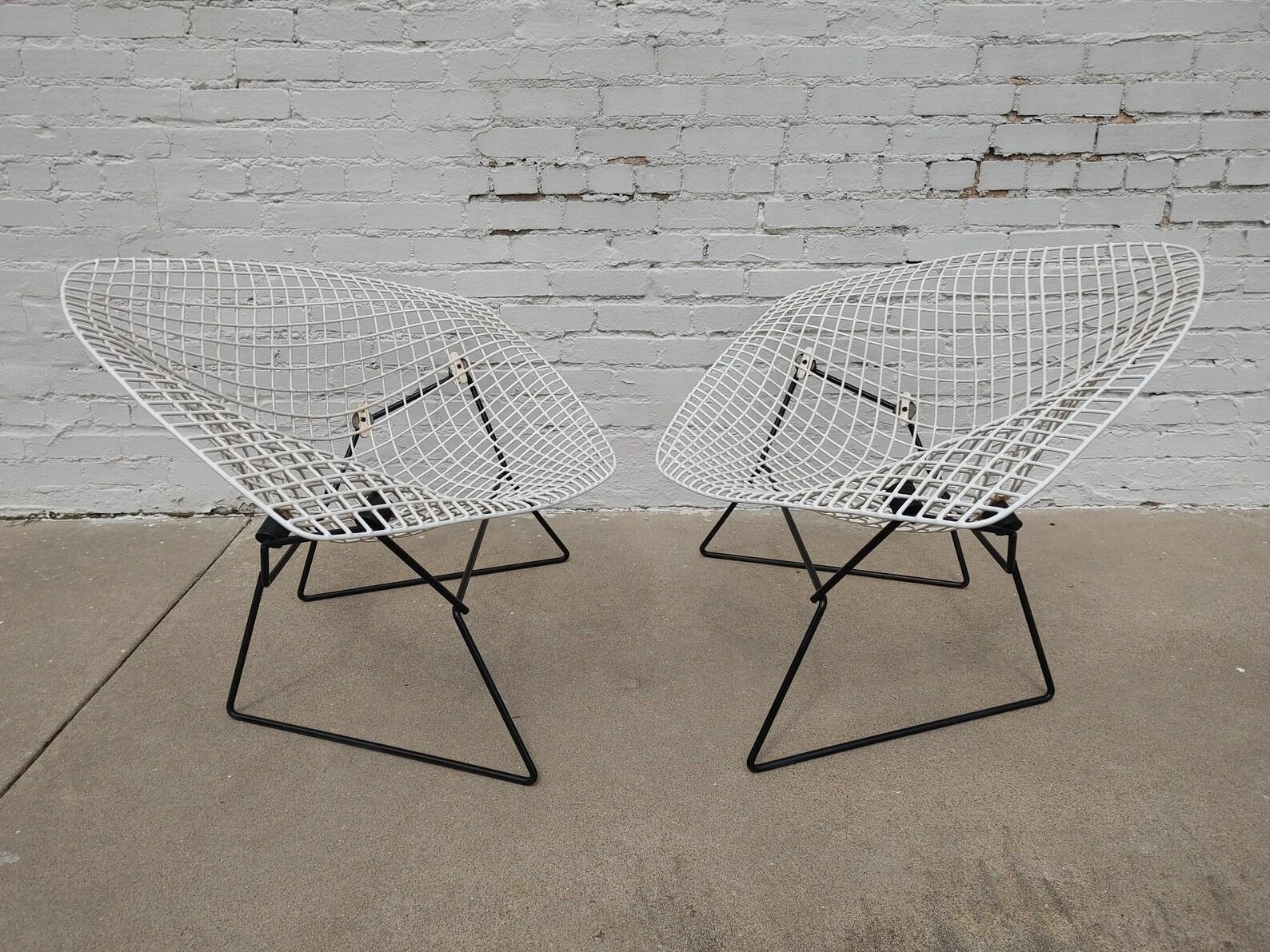 Mid Century Modern Bertoia Large White Wire Diamond Chairs
Good vintage condition and structurally sound. Some discoloration on the white white looks to be bleed through from the underneath wire.
Additional information:
Materials: wire,metal
Vintage