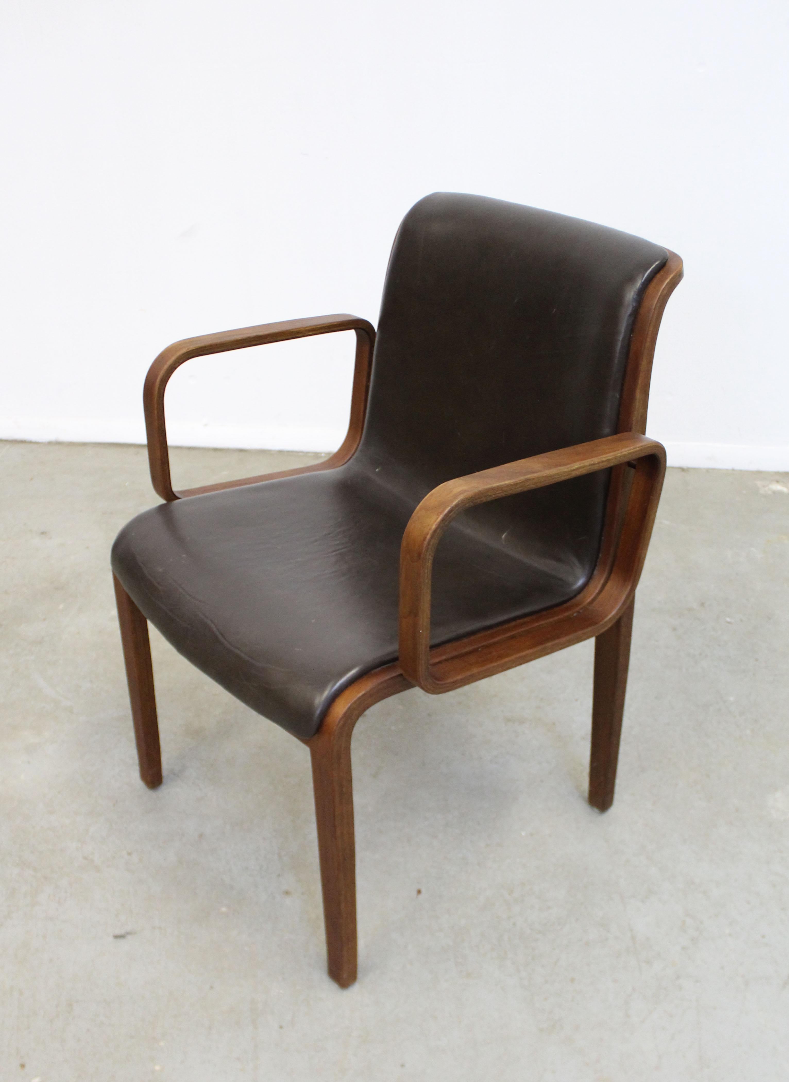 Offered is a vintage Mid-Century Modern armchair (model 1305UO) designed by Bill Stephens for Knoll, circa 1970. It is made with bentwood and we believe the upholstery is Naugahyde or leather. In good condition with some stains on the upholstery and